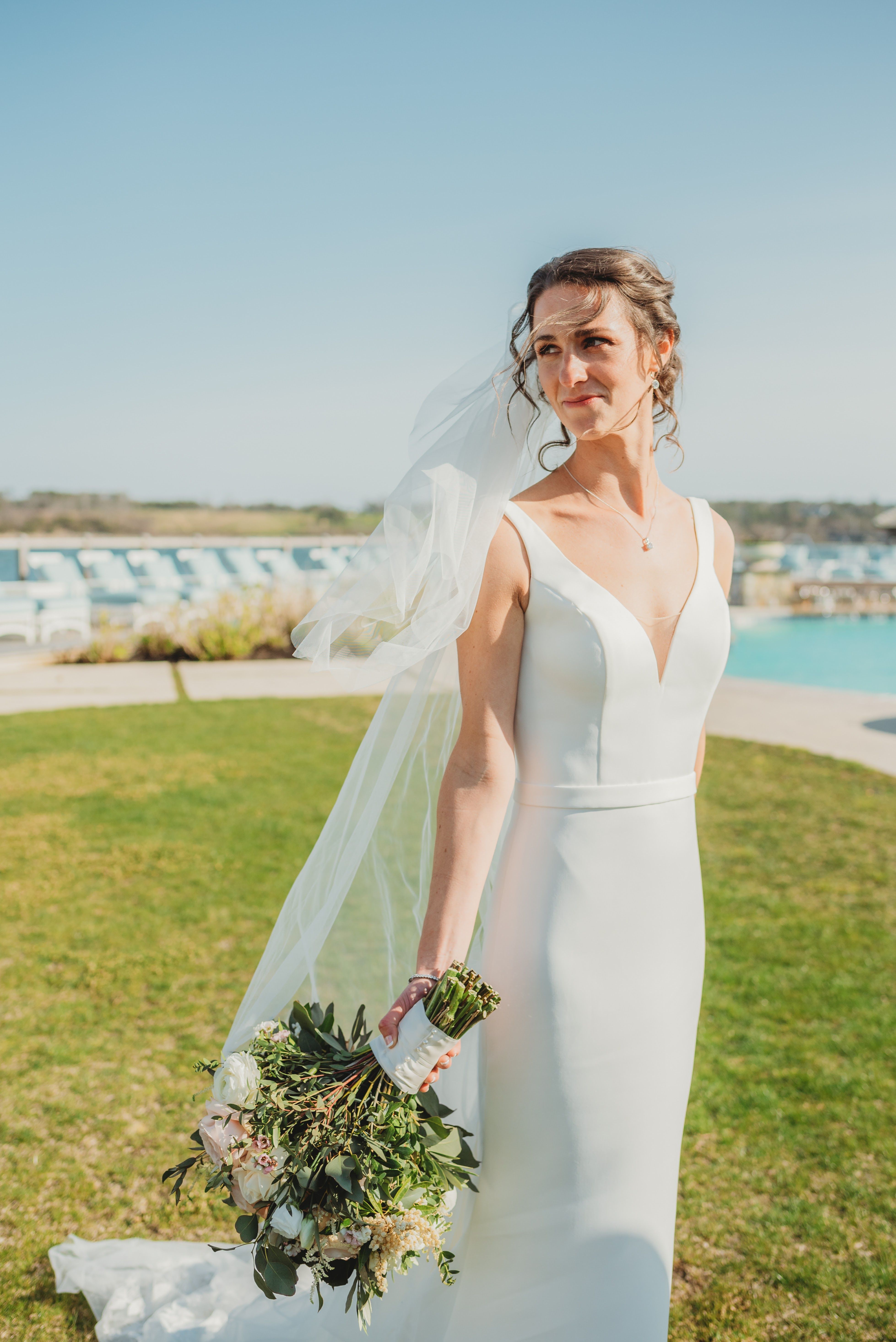 Bride celebrating her wedding day in a romantic designer gown from Aleana’s Bridal