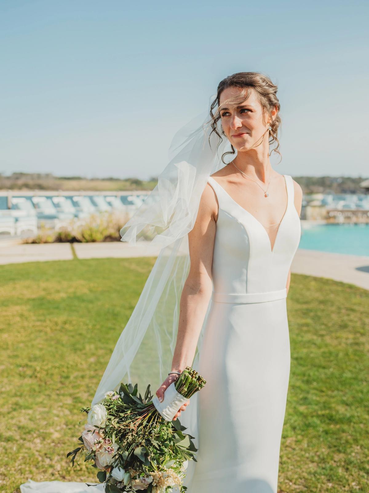 Bride celebrating her wedding day in a romantic designer gown from Aleana’s Bridal