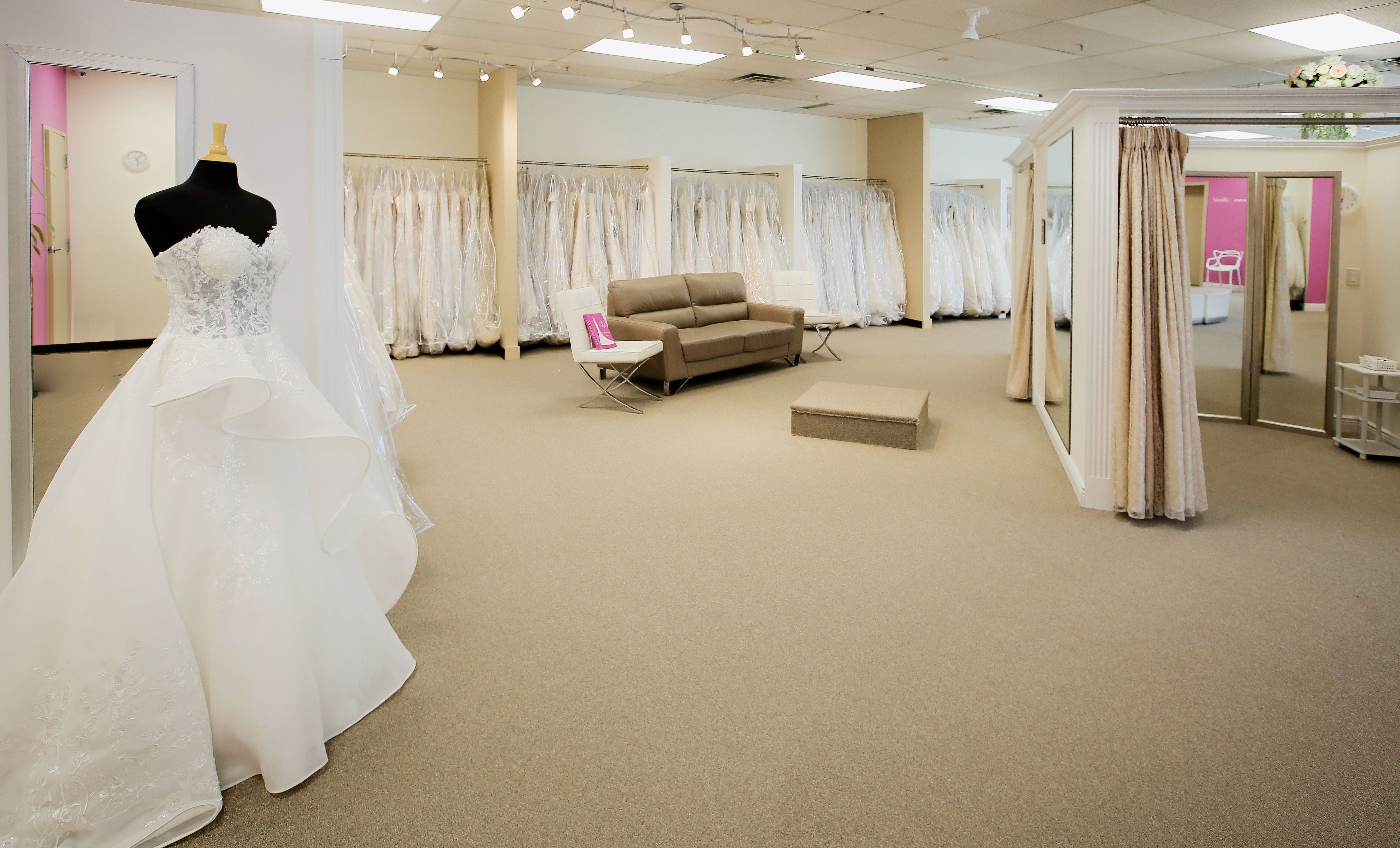 Designer wedding gowns on the racks at Aleana's Bridal