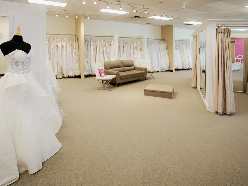 Designer wedding gowns on the racks at Aleana's Bridal