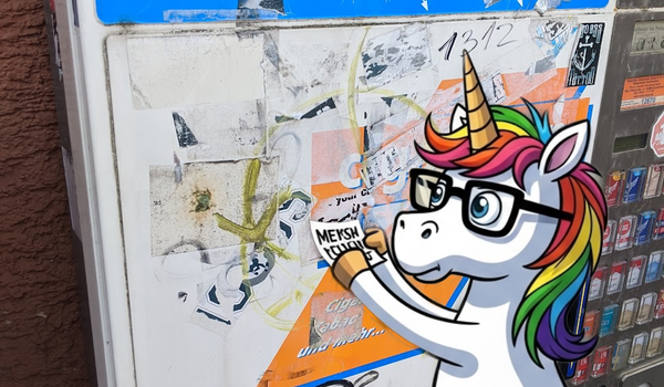 Unicorn adding a sticker to an old cigarette venfing machine