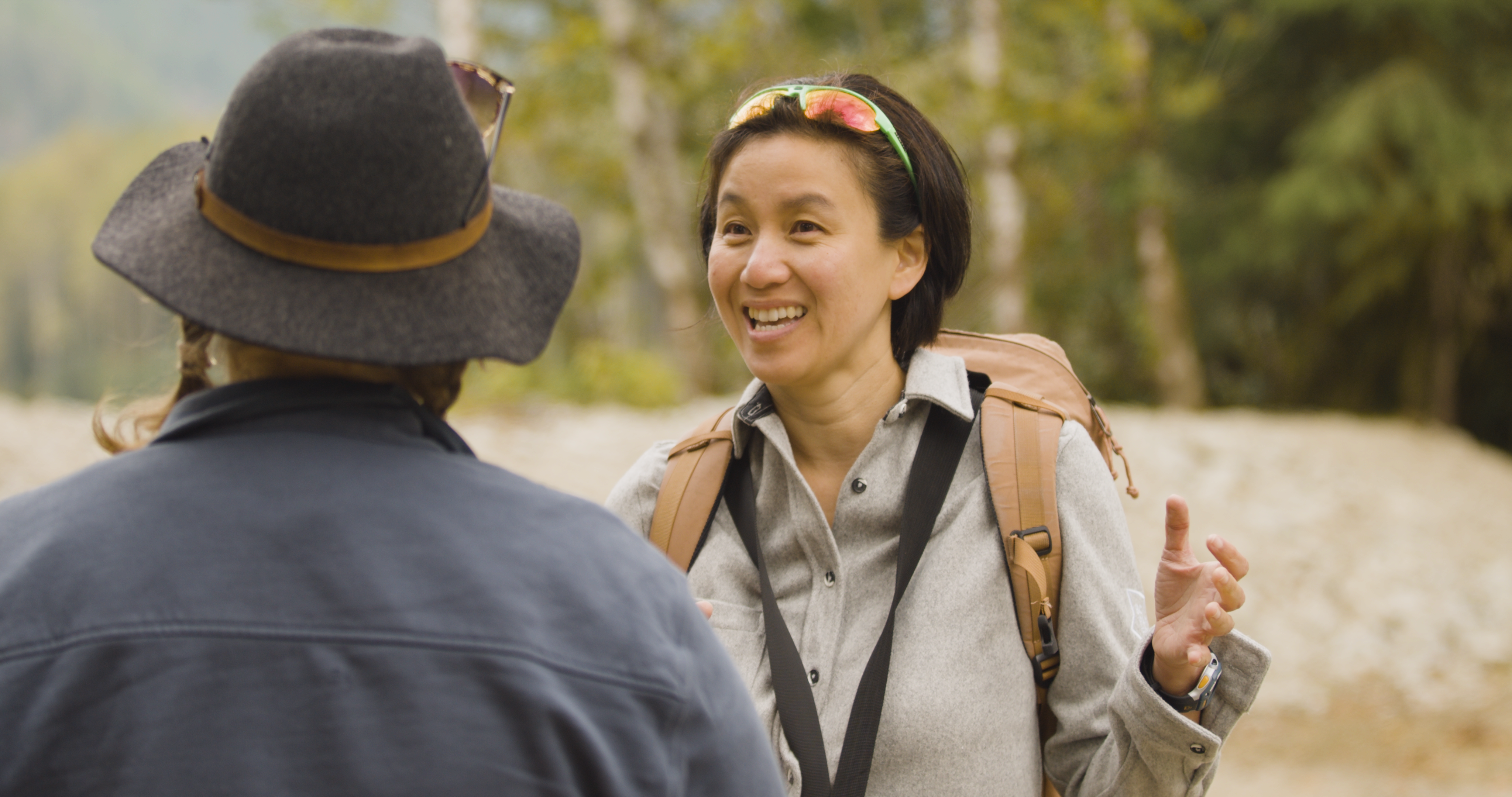 Two people talk at Upper Pitt River