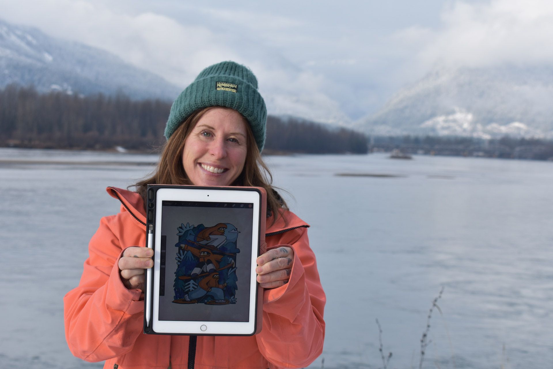 Turbo Bambi holds an iPad with her artwork to the screen
