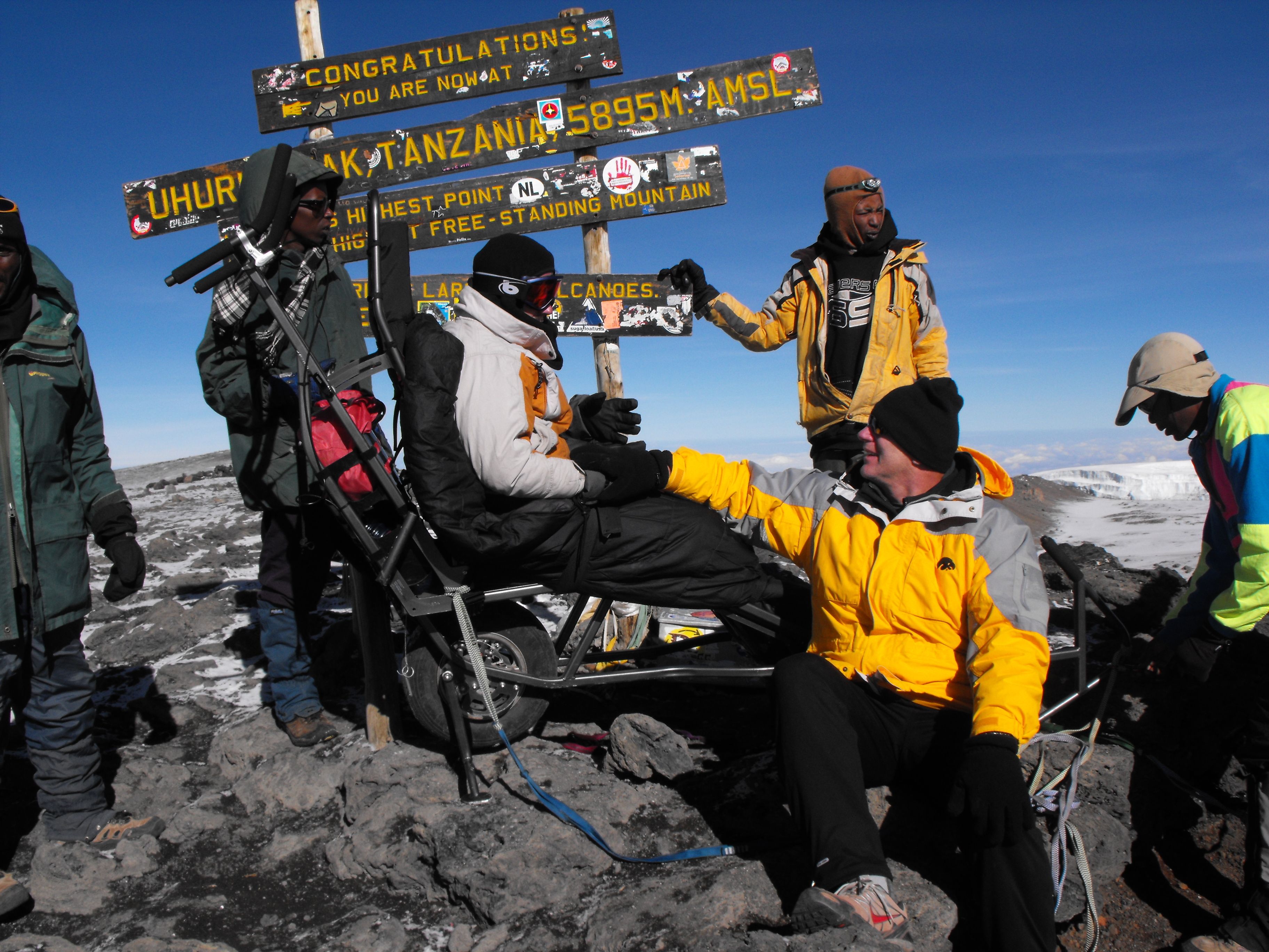 The TrailRider helps this hiker summit Mount Kilimanjaro (Photo courtesy of BCMOS)