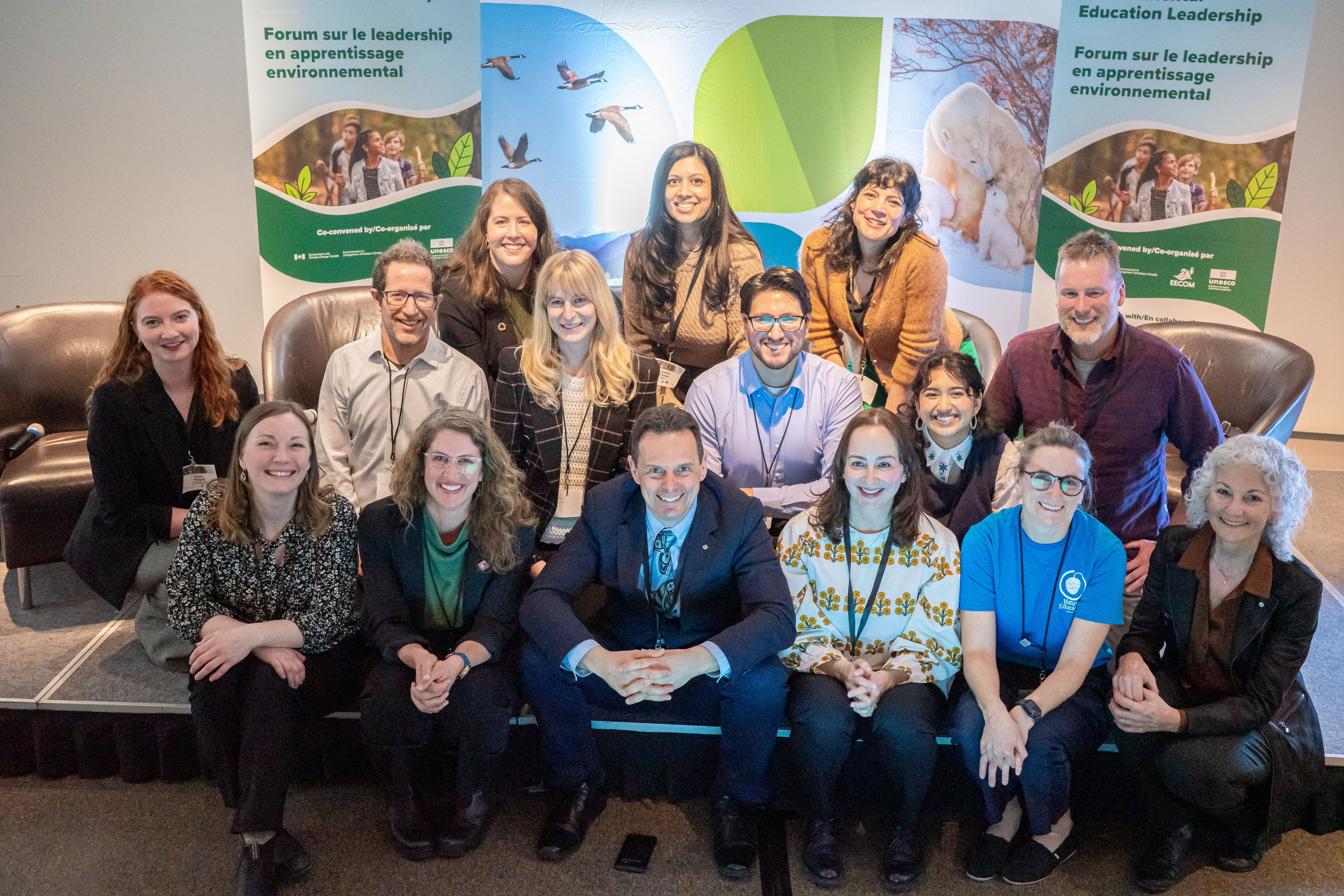 Group of people from National Environmental Learning Forum Advisory Committee smiling at camera 
