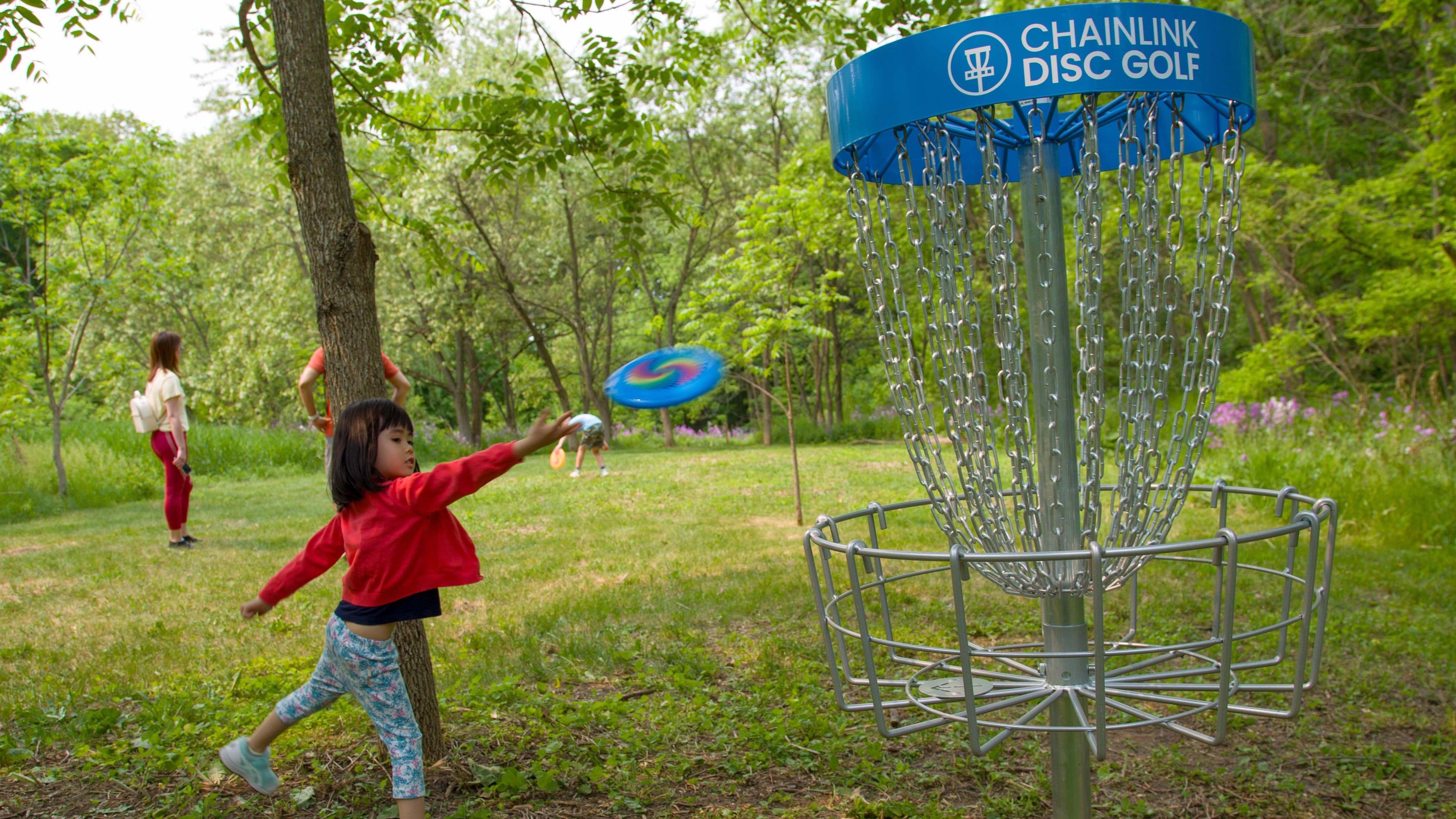 Child plays disc golf