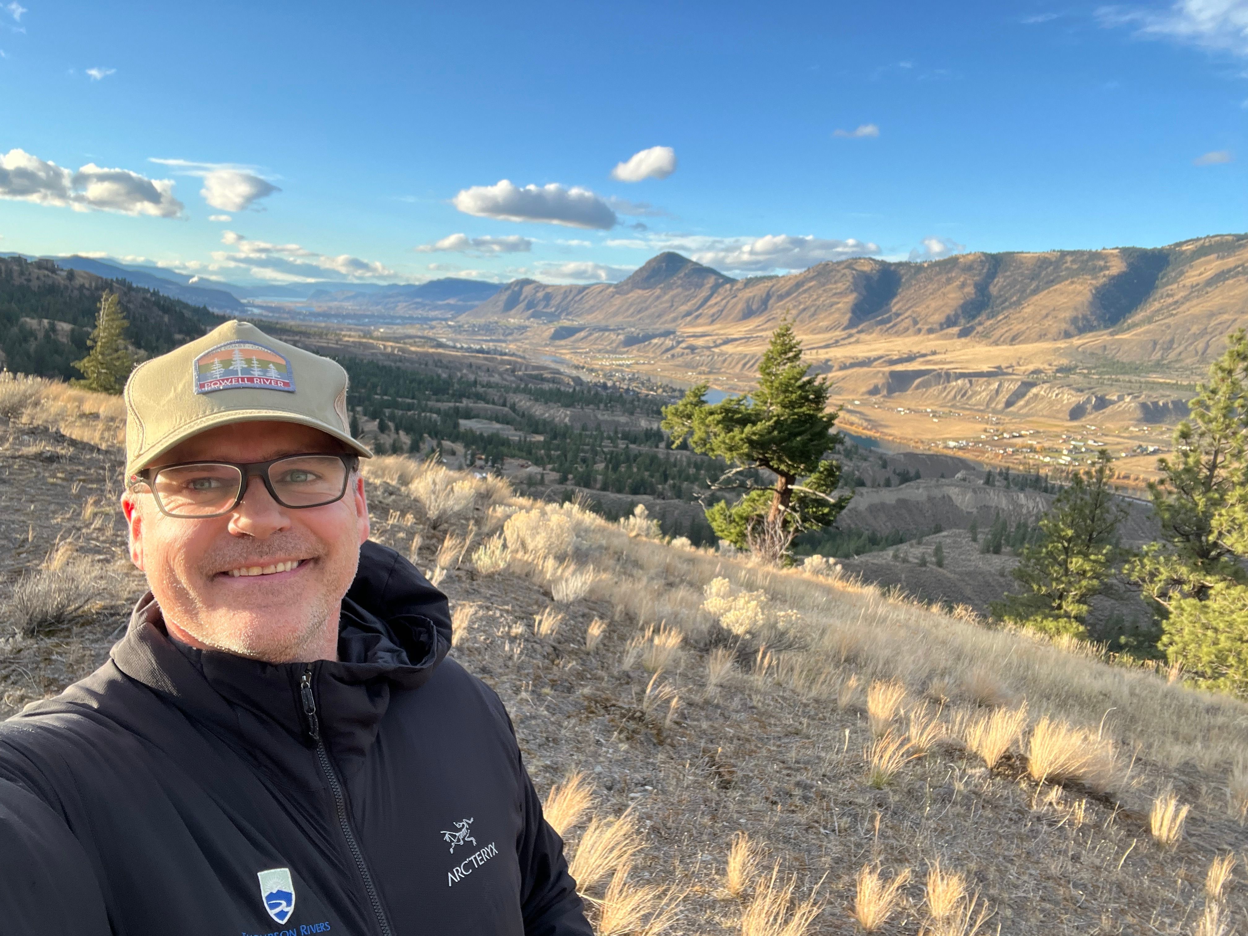 Man takes selfie at grasslands