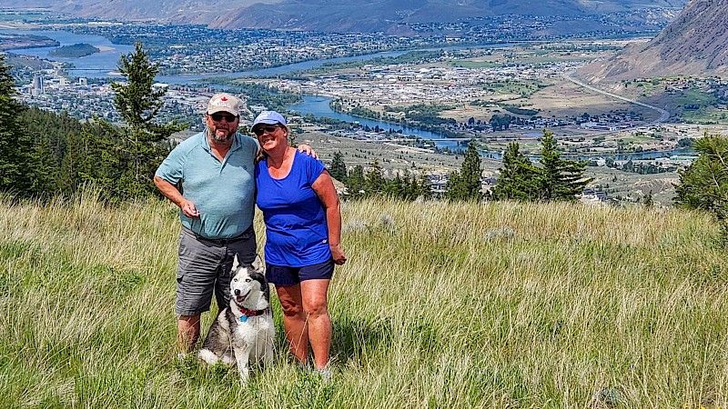 Leah and Rendal stand in Juniper Ridge grasslands