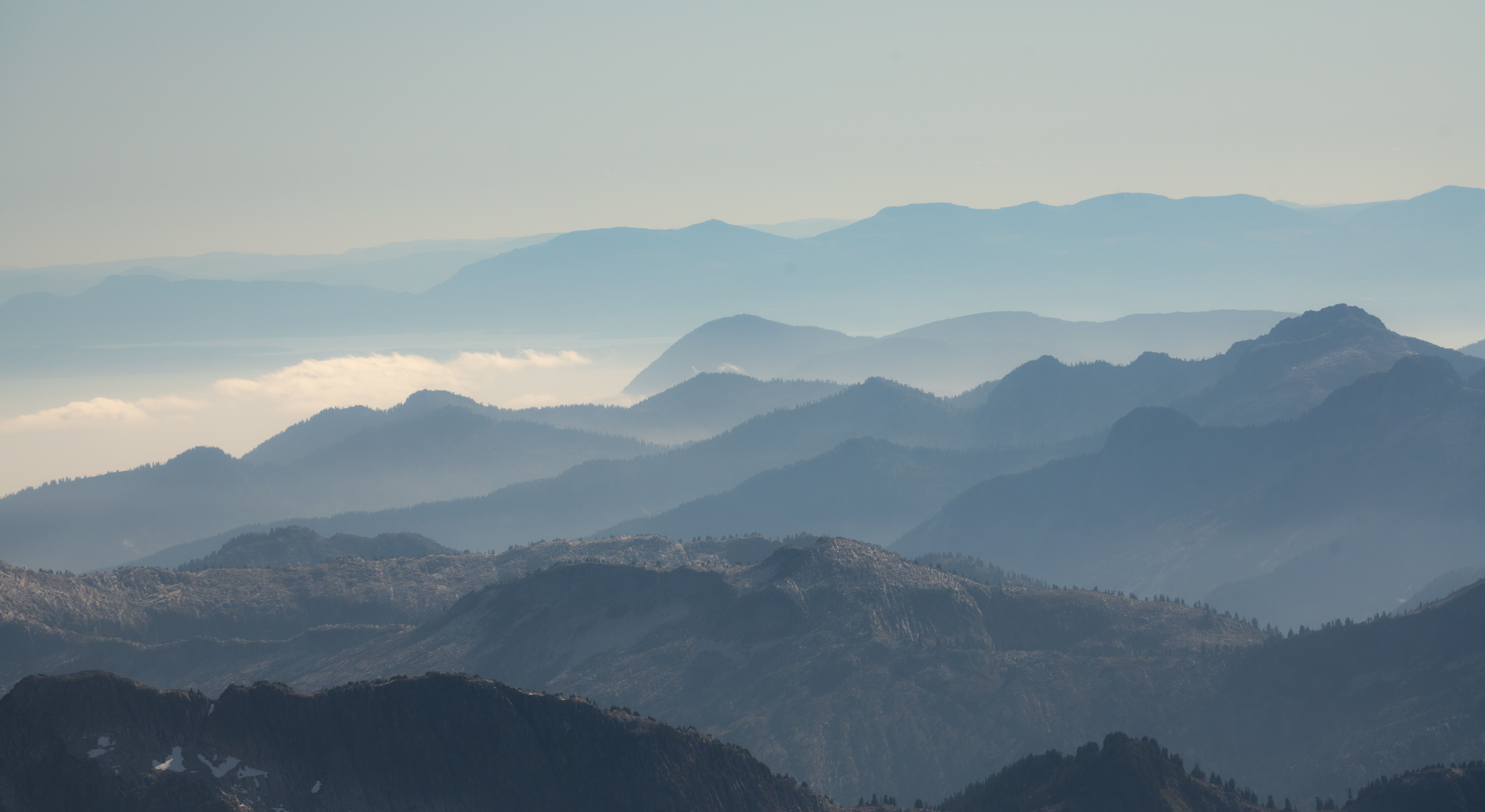 Footage of rolling mountains and rocky cliffs