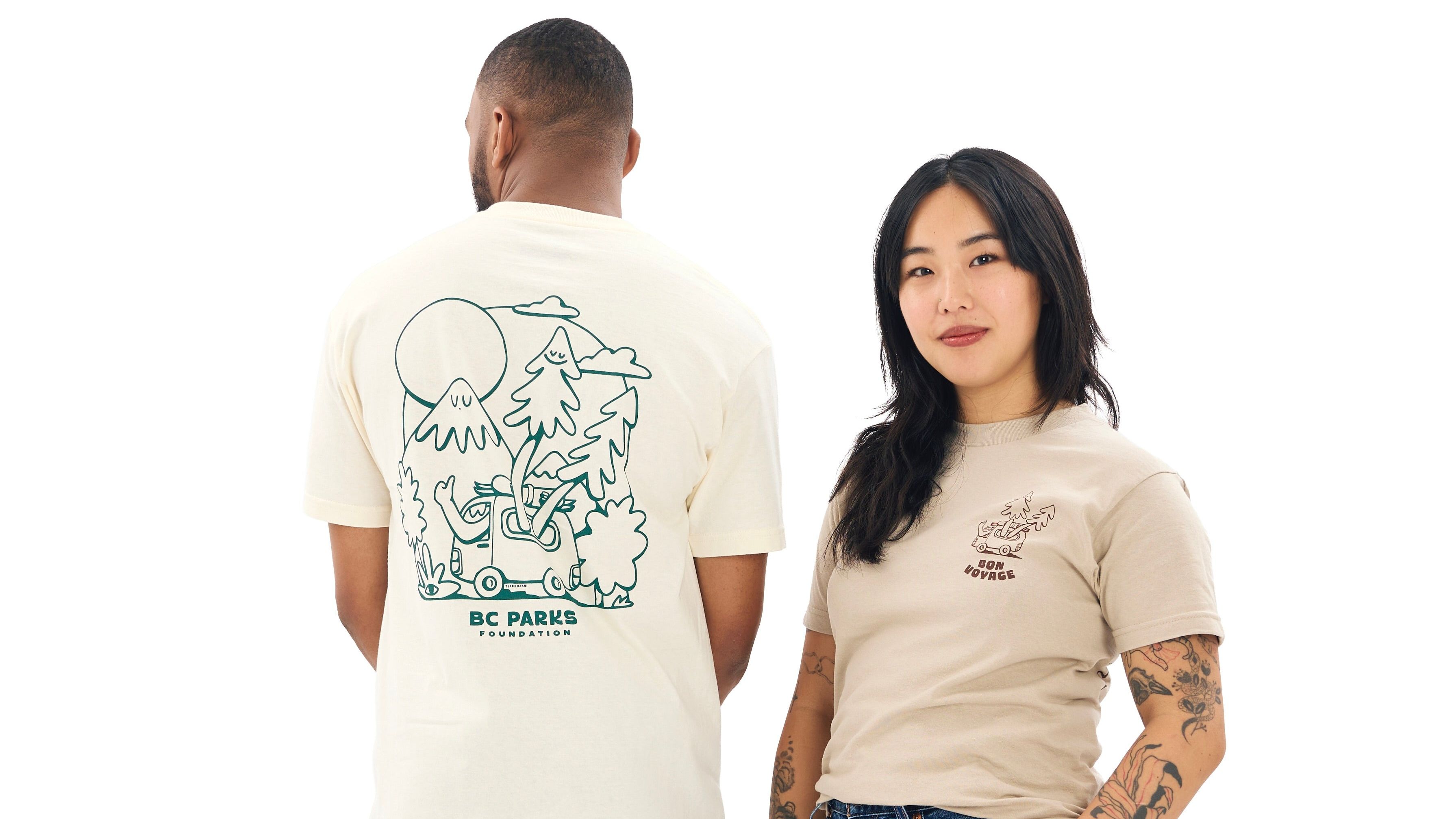 Two people modelling a t-shirt featuring a camper van illustration created for the BC Parks Foundation x Turbo Bambi collaborative collection.