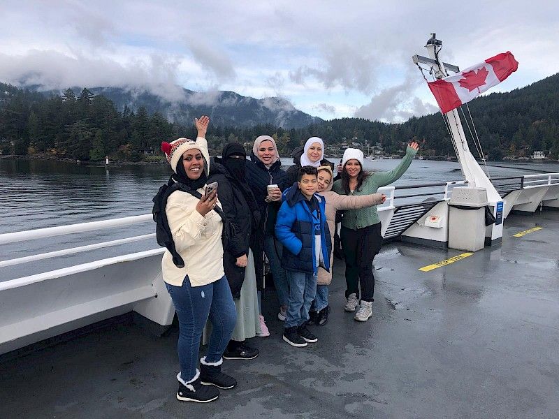 Participants from REACH Community Health Centre enjoy the ferry ride to Bowen Island, ready for a day of joy and connection in nature, supported by the Spark Fund by BC Parks Foundation.
