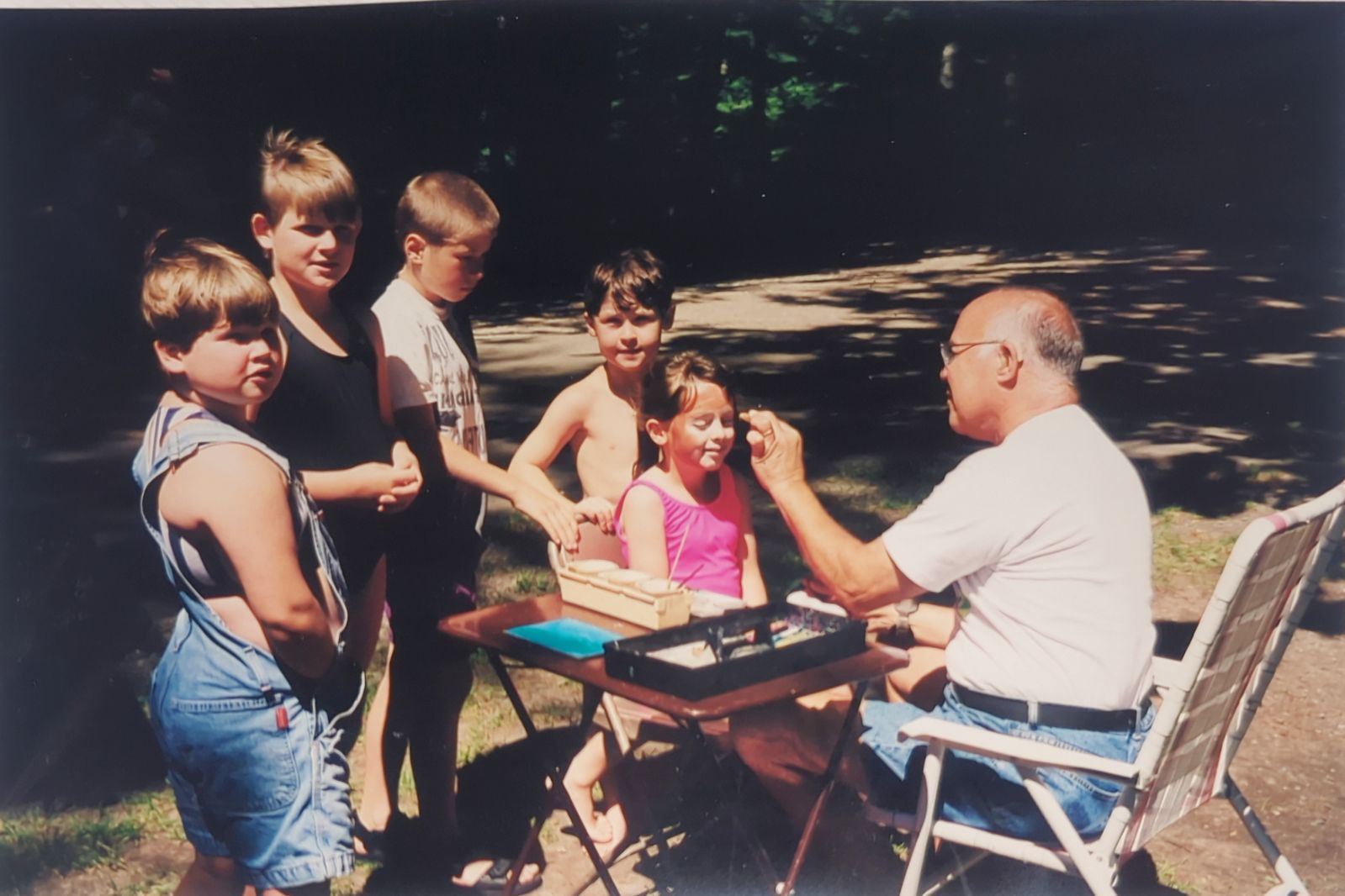 Parks Day, 2005, Alice Lake Park: Lynn’s daughter's father-in-law face painting for the children. 
