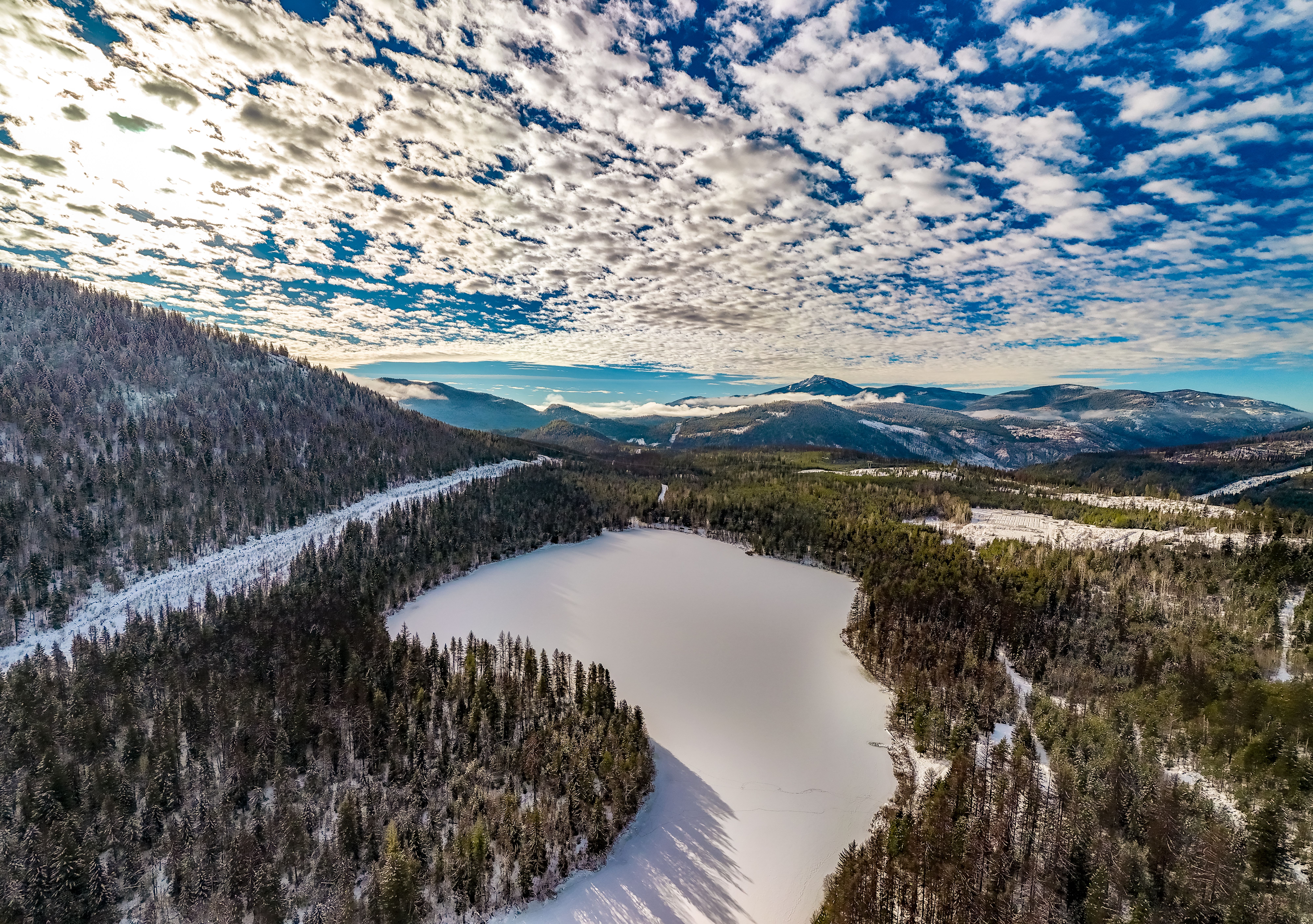 Rosebud Lake with forests and mountains in background