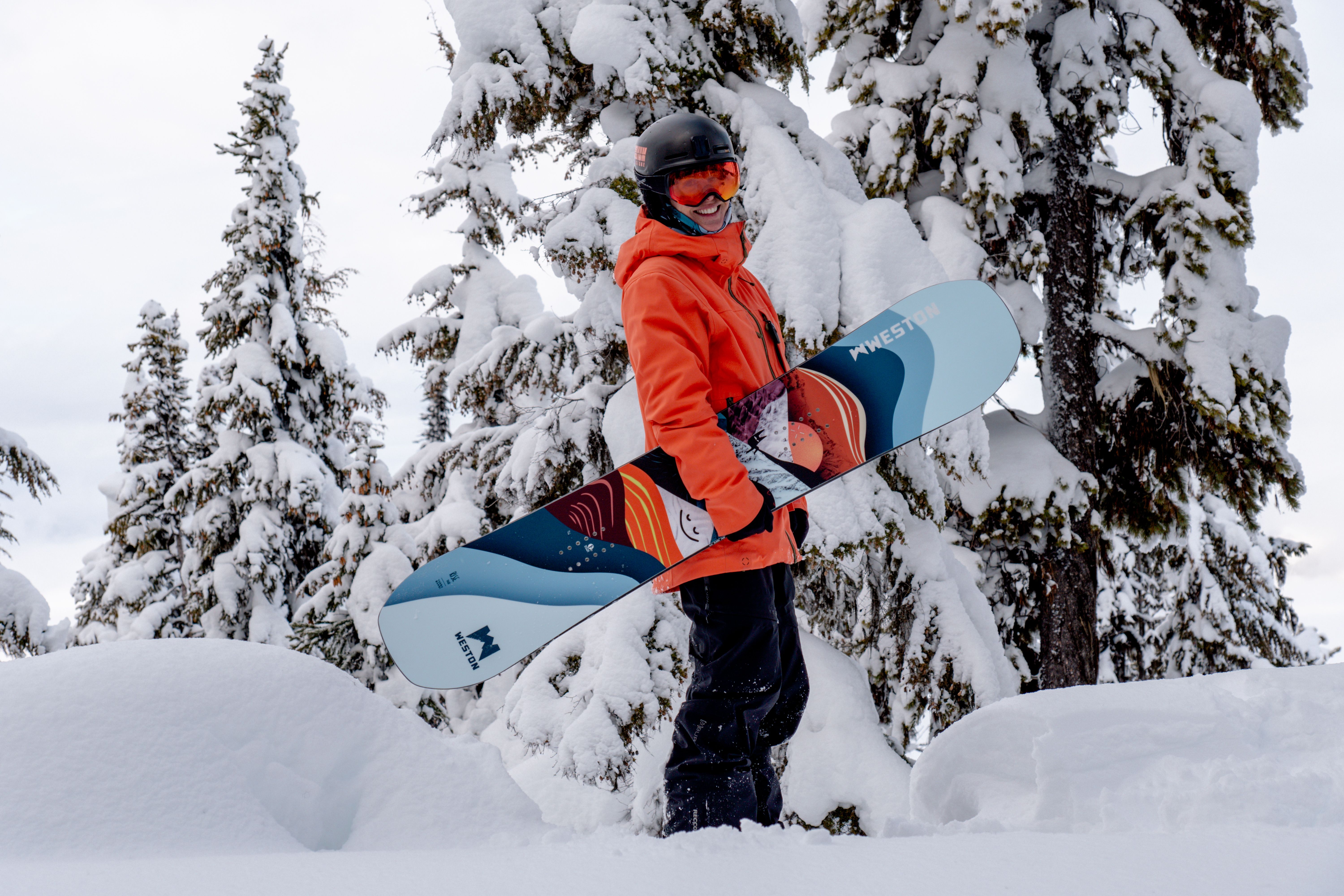 Artist Turbo Bambi (aka Claudia Simon) poses at Revelstoke Mountain Resort with her snowboard art design for Weston Backcountry.