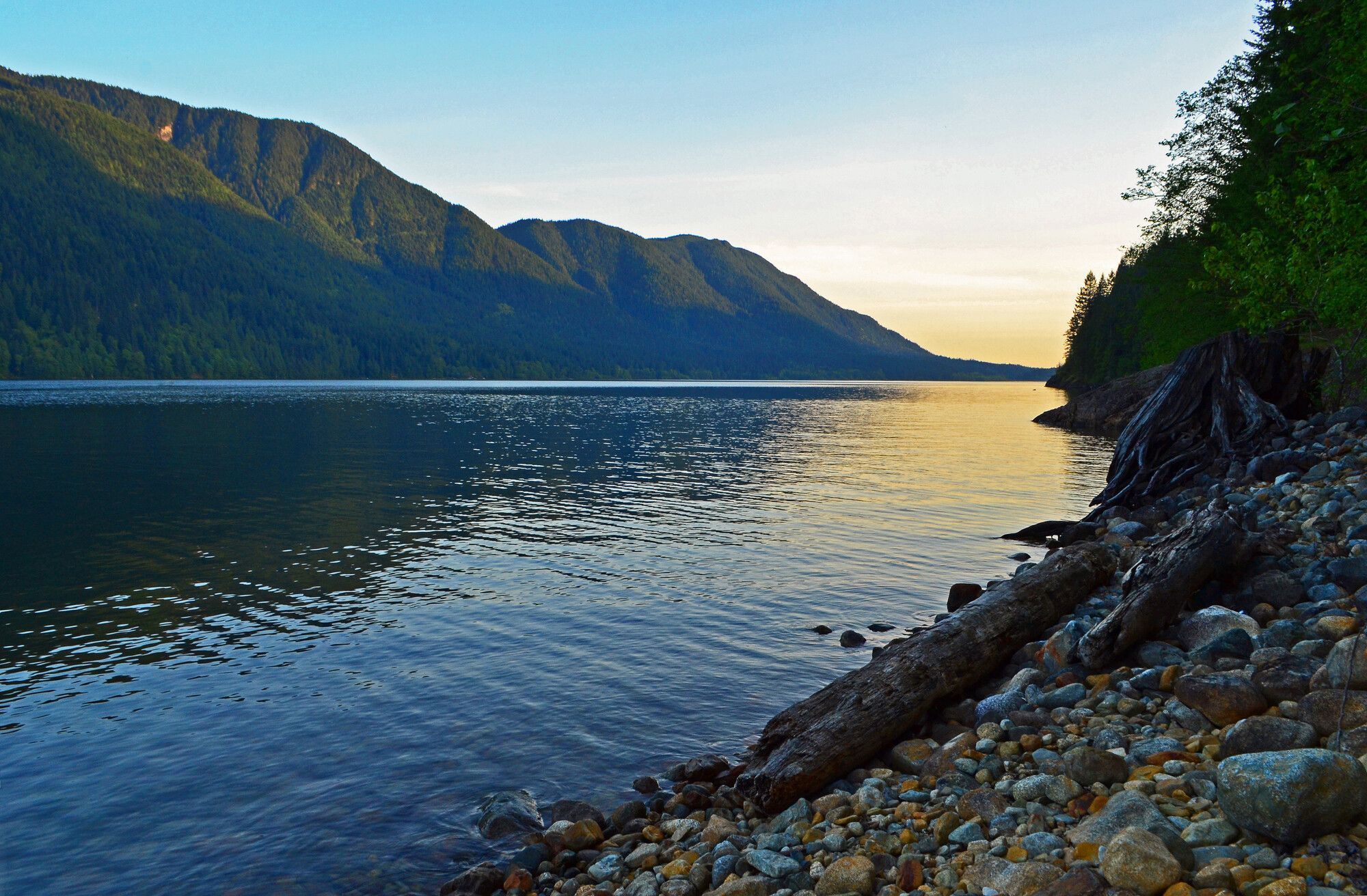 A shimmering lake under a setting sun