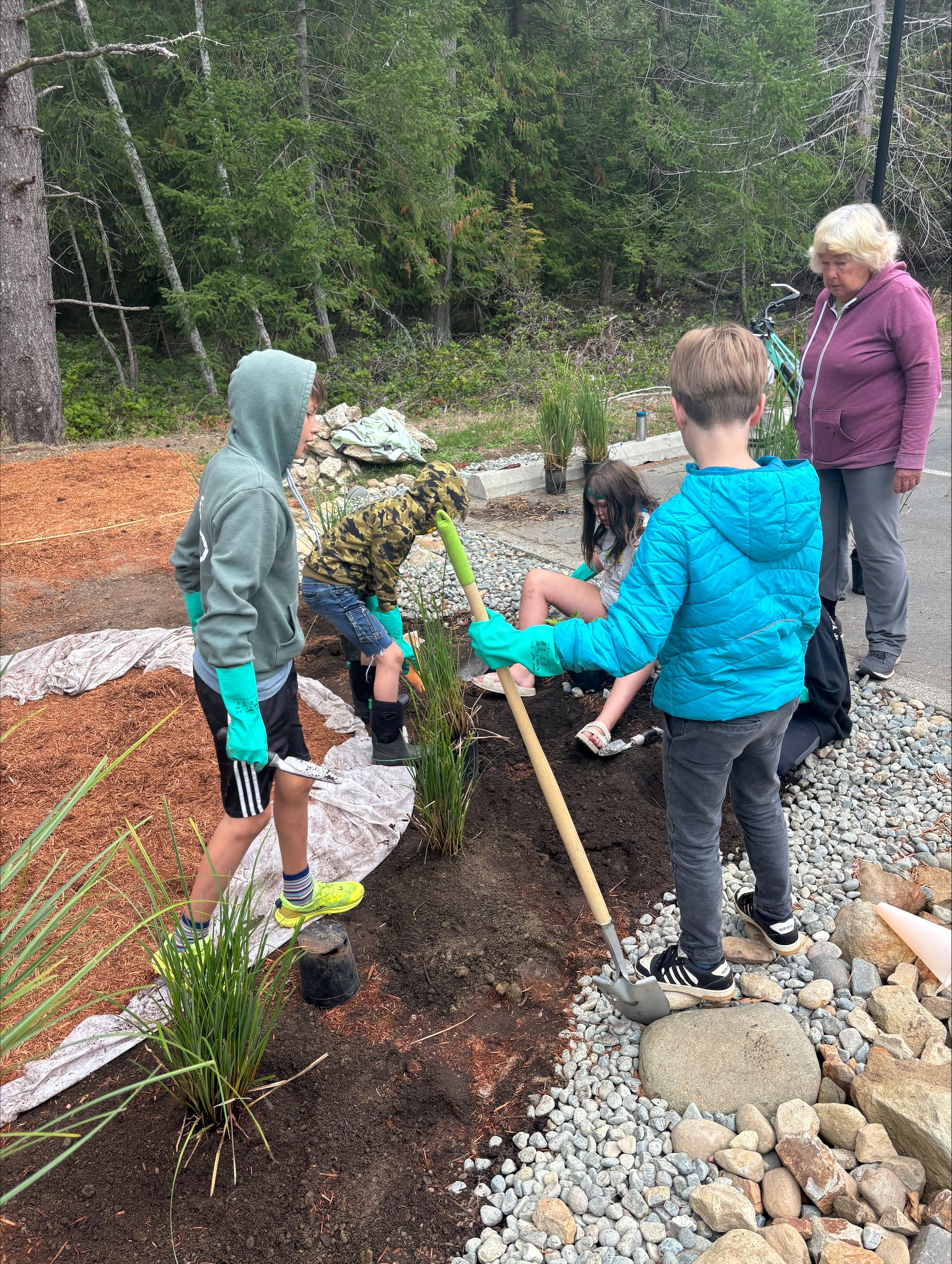 Kids planting a garden on schoolground