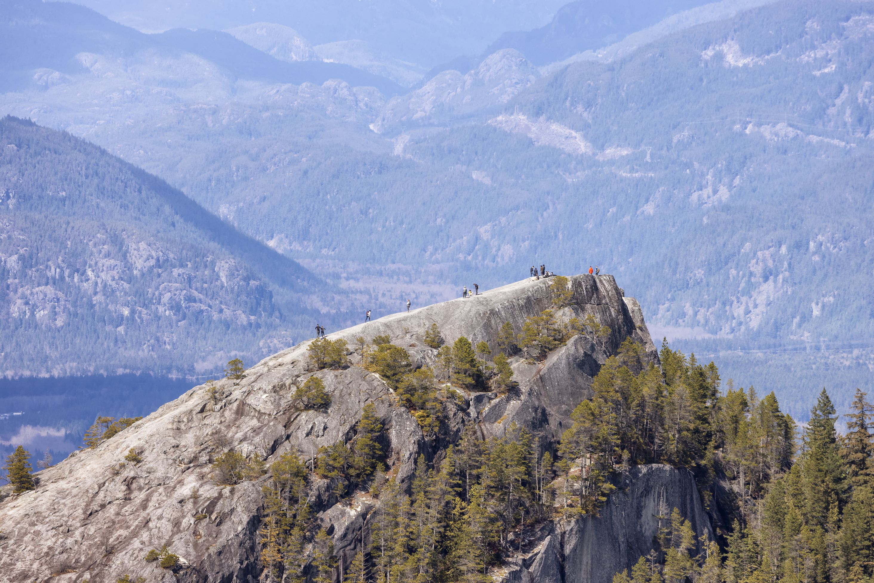 Group of hikers on a cliff.