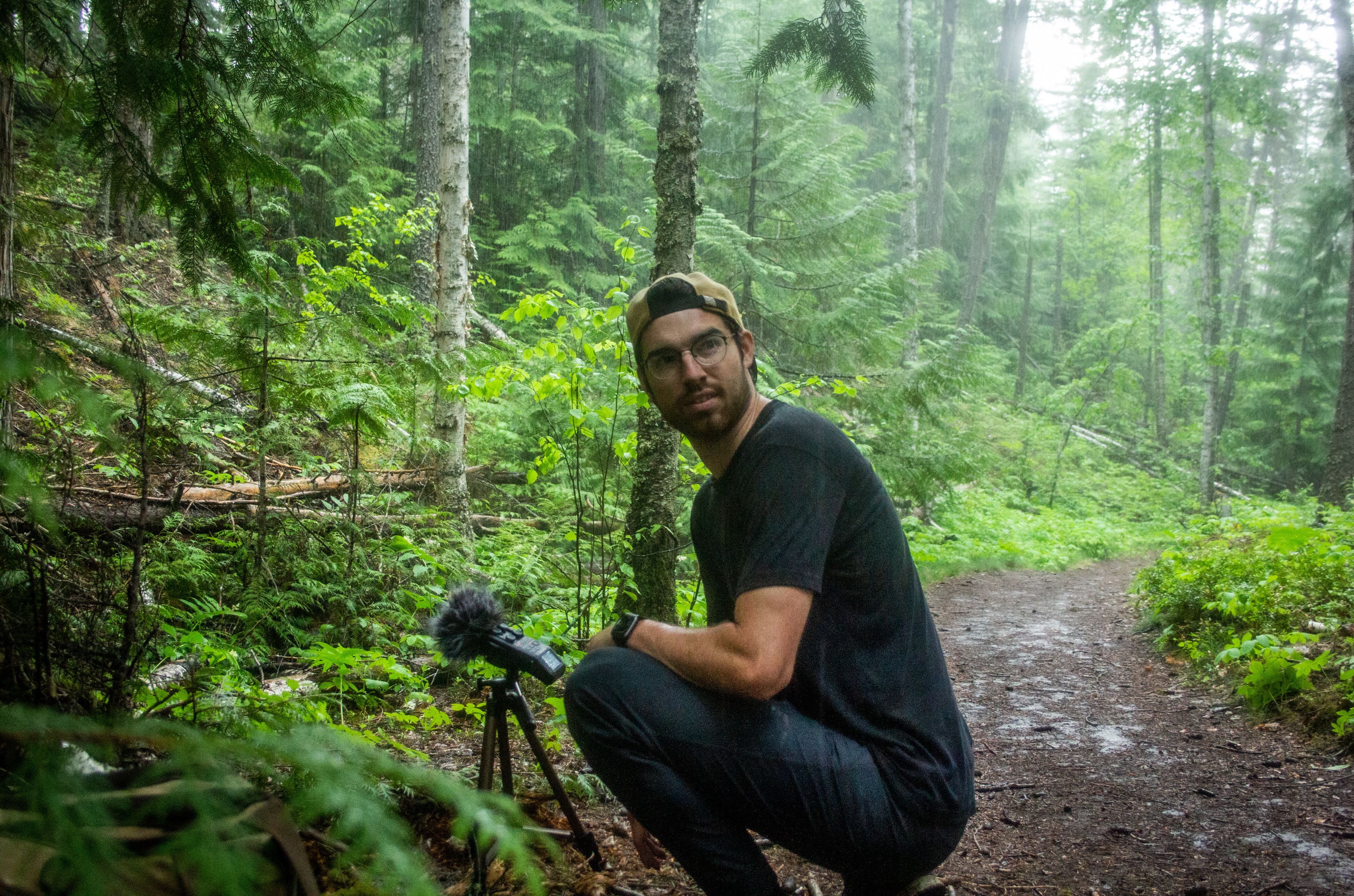 Man records audio in rainforest