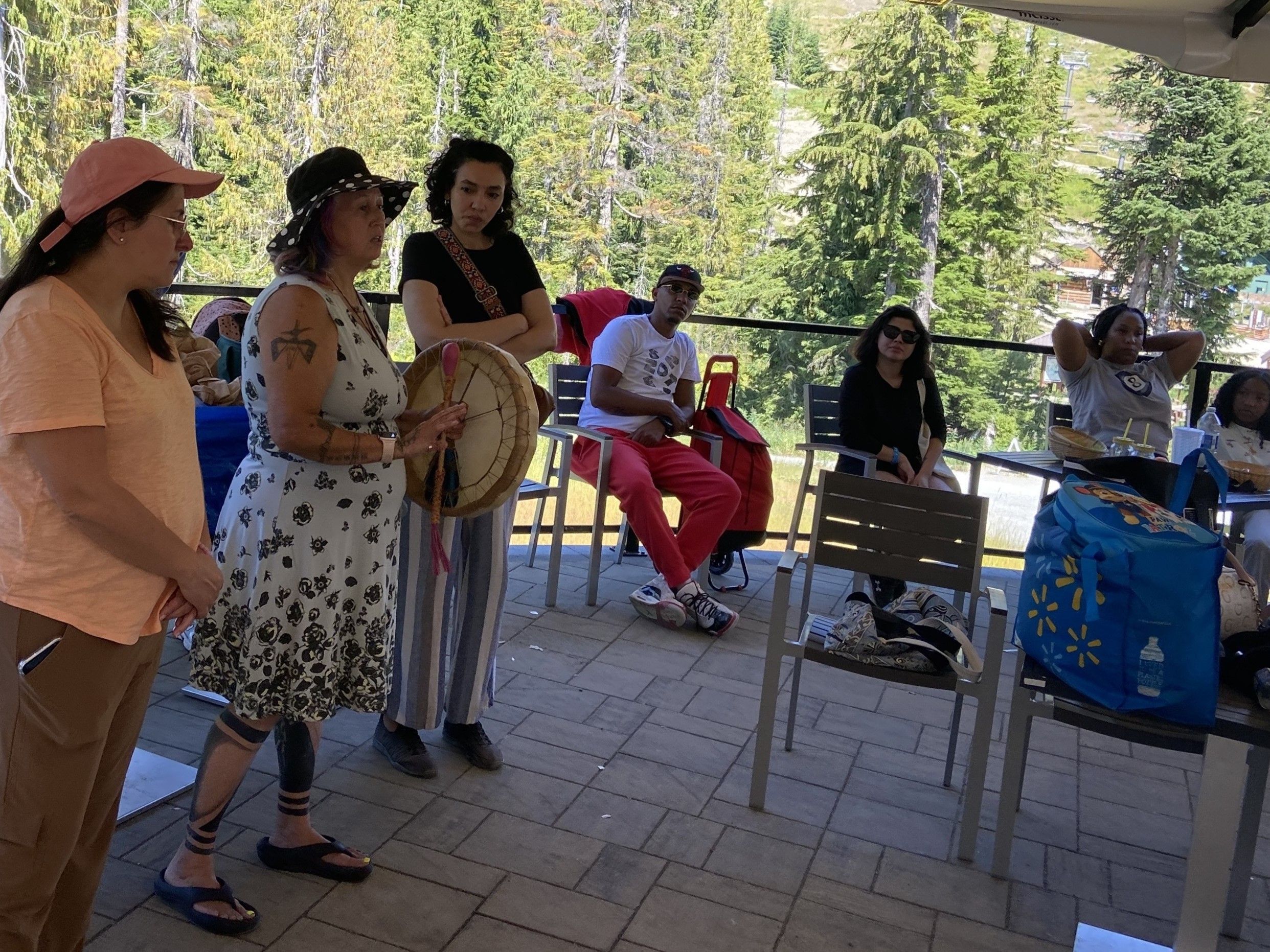 Indigenous Knowledge Keeper from Squamish territory sings a song and the story of the Twin Sisters.