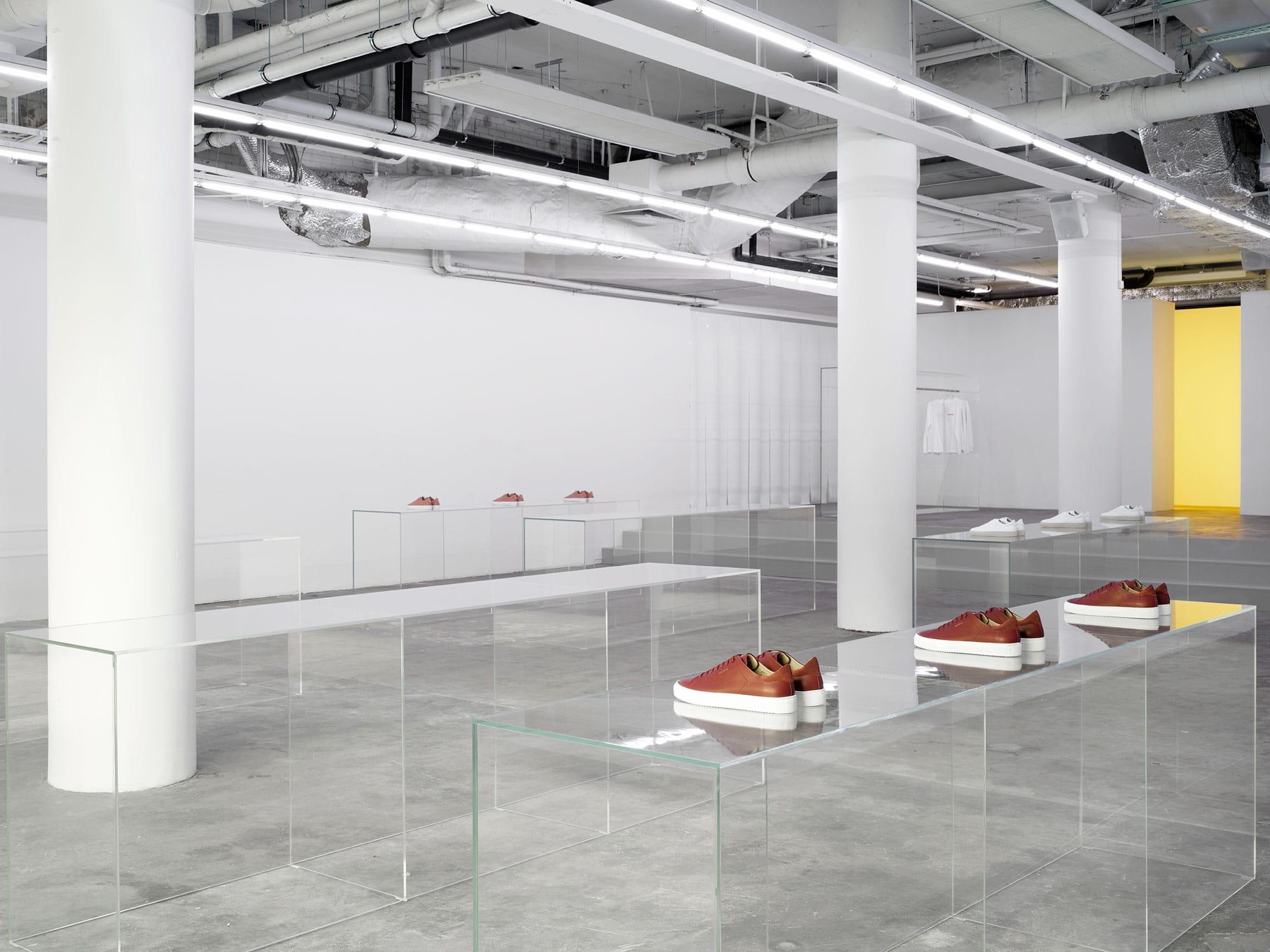 Interior design by Halleroed for Axel Arigato in Norrmalmstorg, Stockholm — image 6 of 9