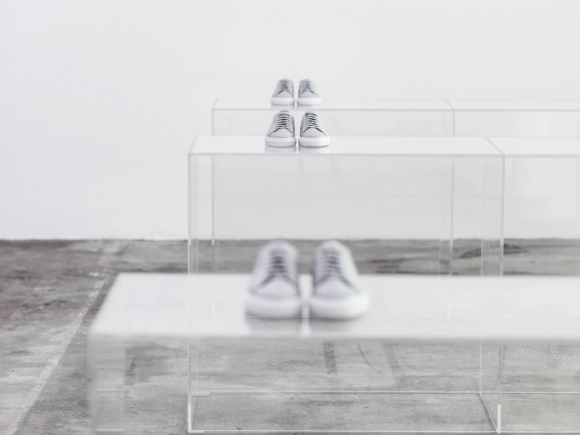 Interior design by Halleroed for Axel Arigato in Norrmalmstorg, Stockholm — image 8 of 9