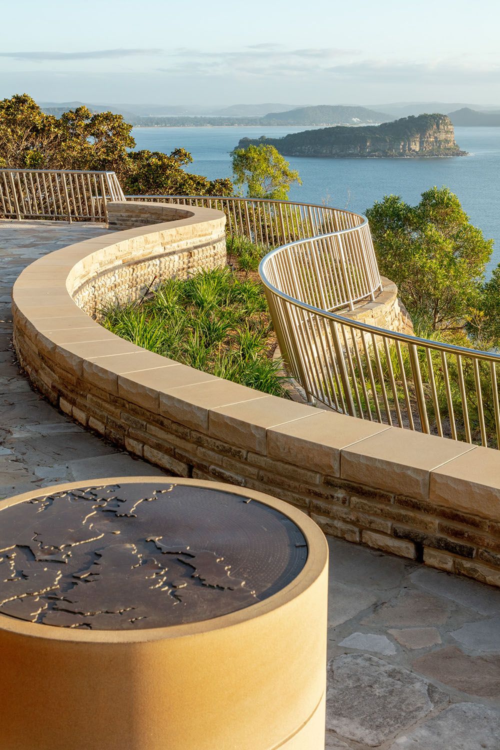 A photograph of a map on a sandstone plinth. 