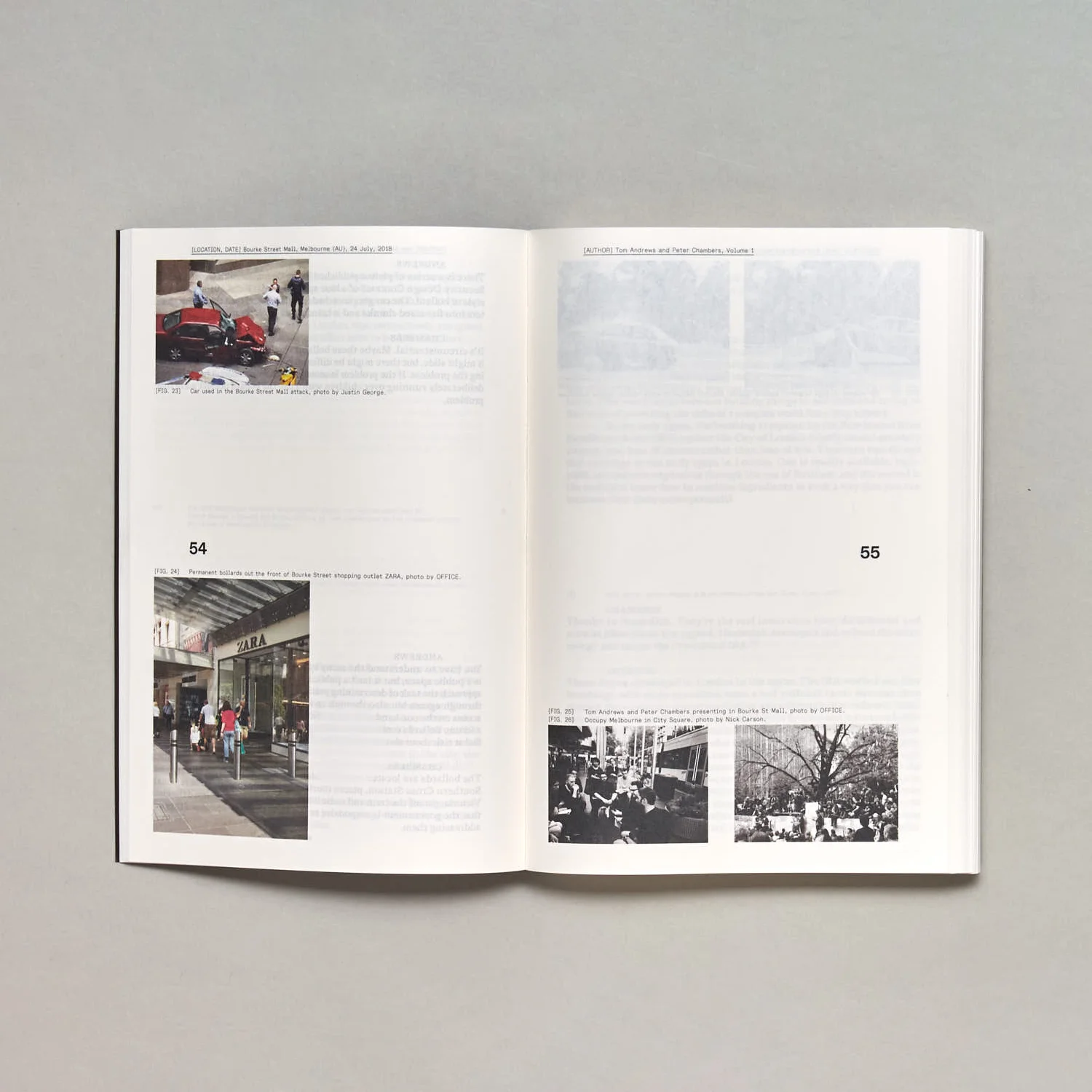 A photo of an open book, the page layout is mostly white space with four small images near three corners of the spread.