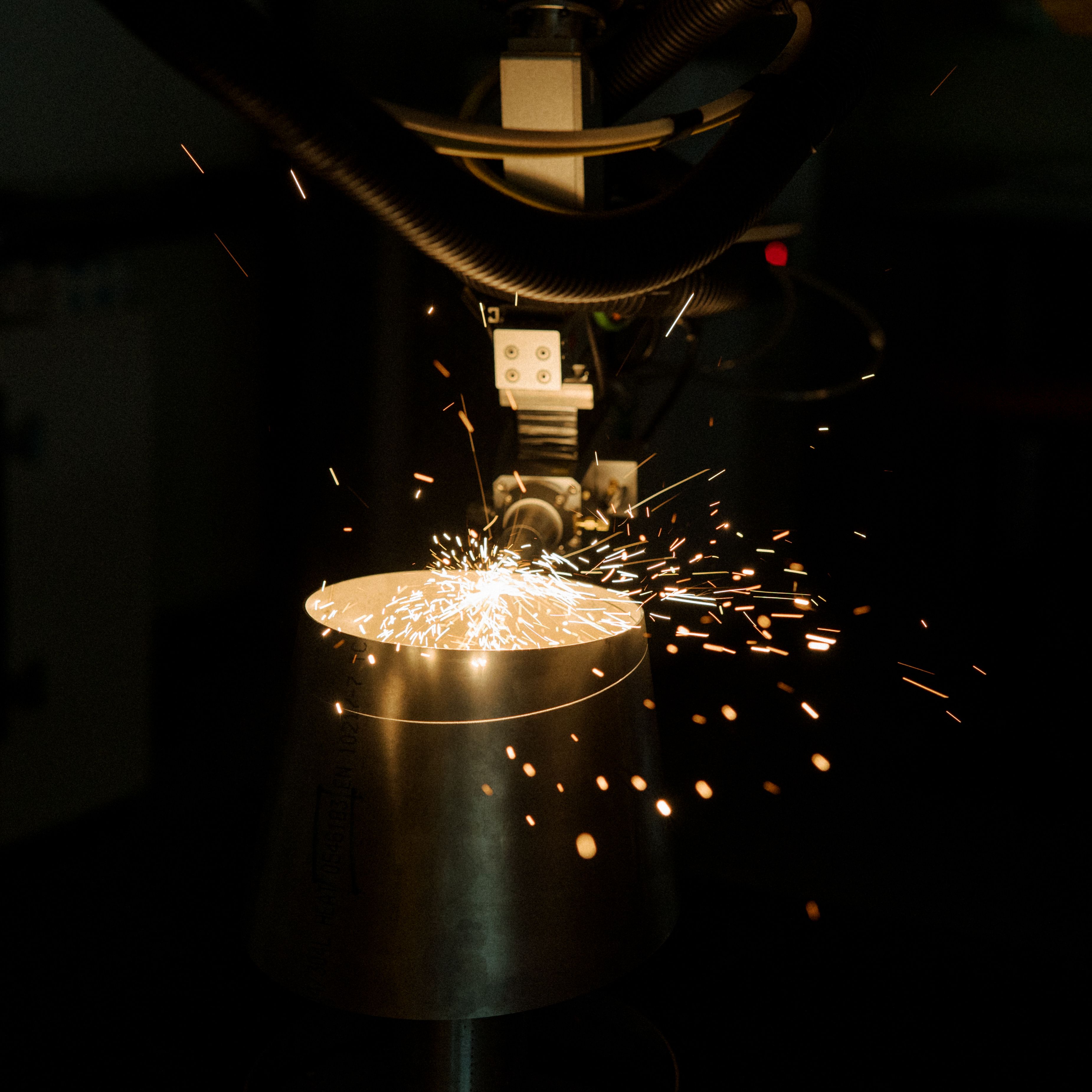 Robotic laser cutting of a stainless steel weld fitting