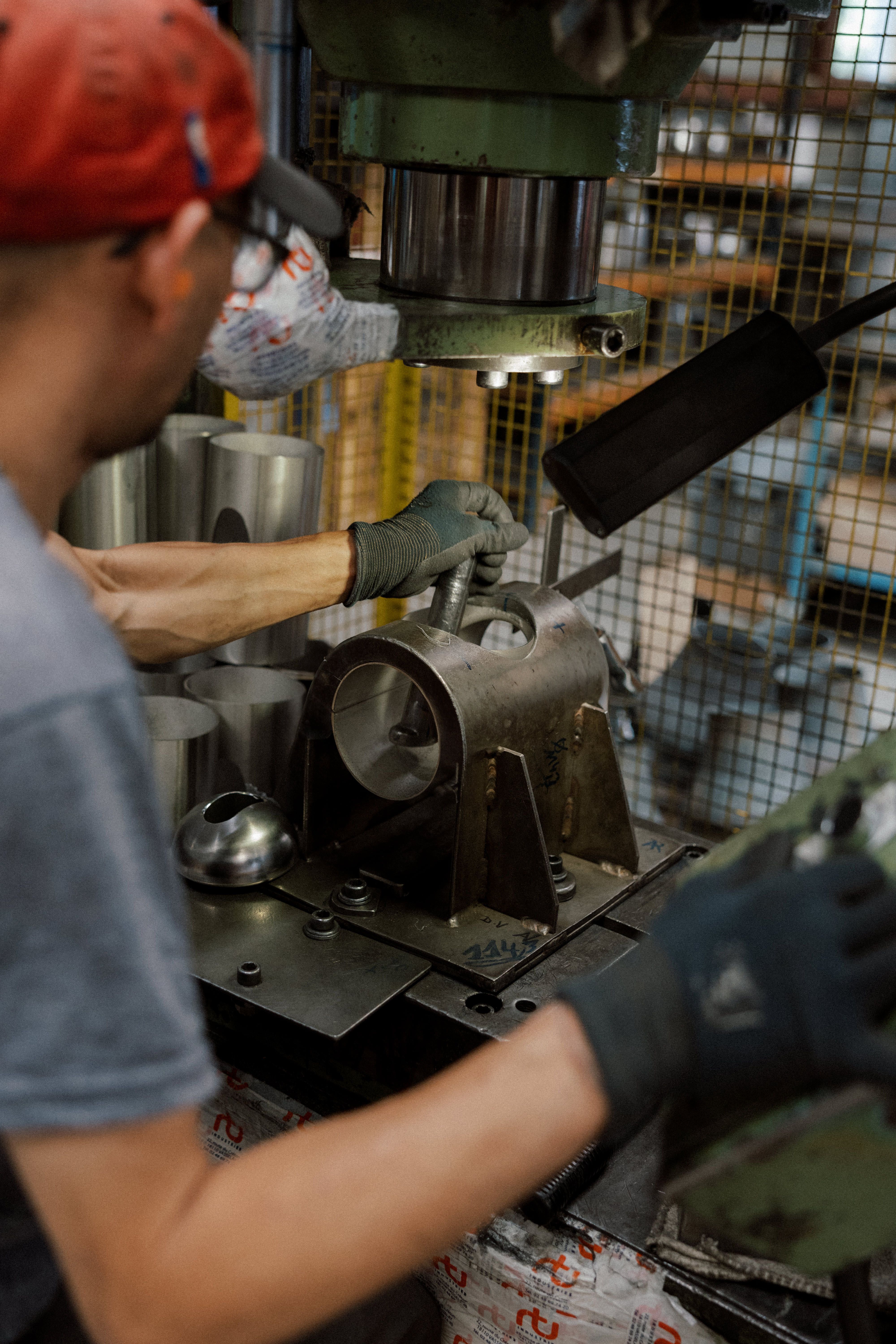 Stamping and extrusion of a stainless steel weld fitting