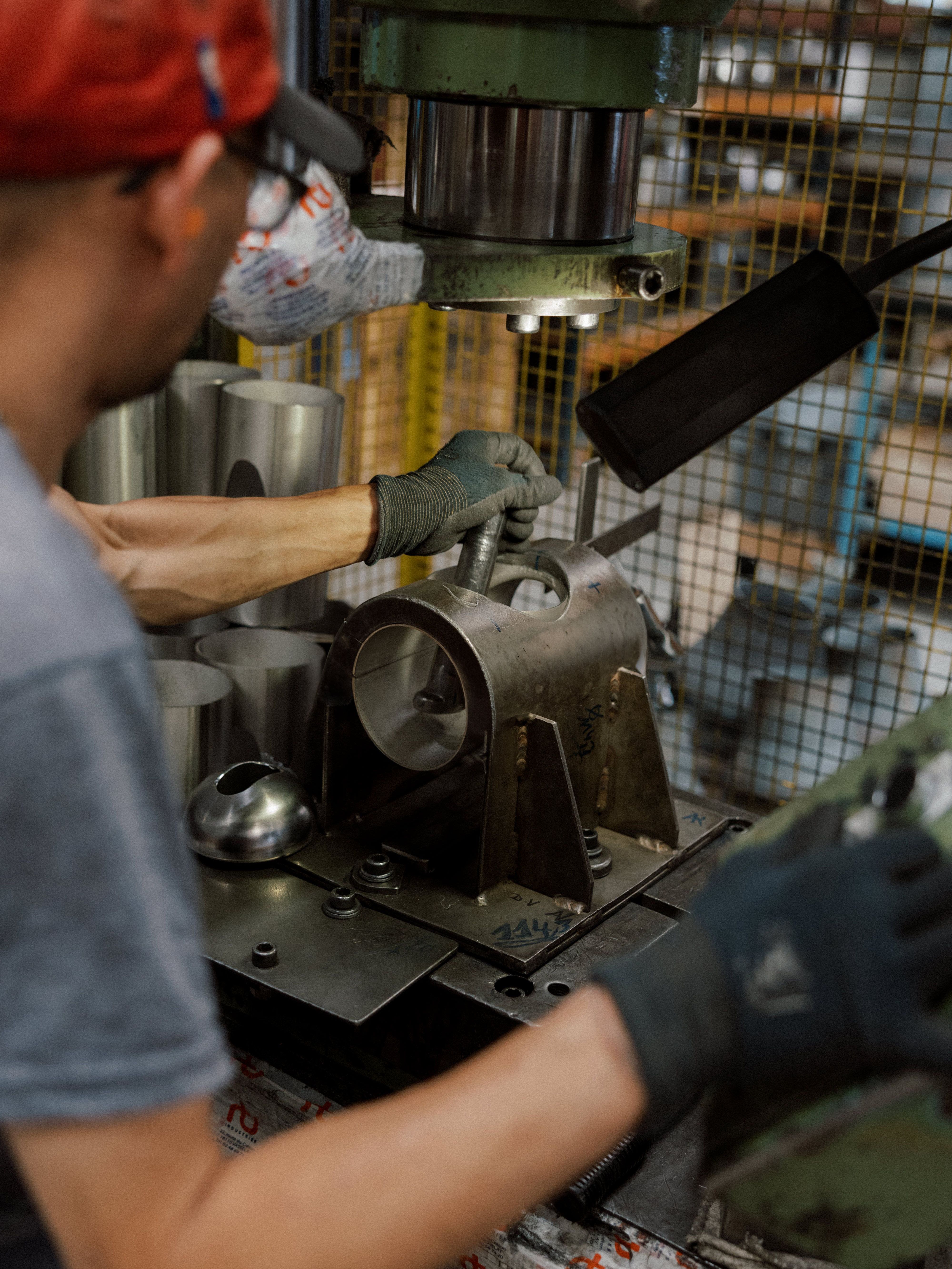 Stamping and extrusion of a stainless steel weld fitting