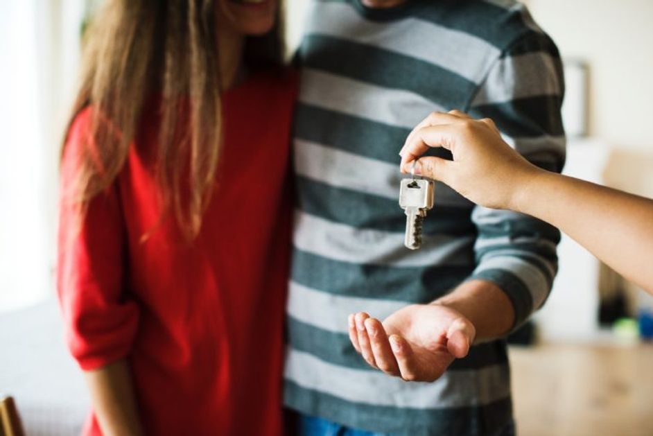 Couple being handed over keys