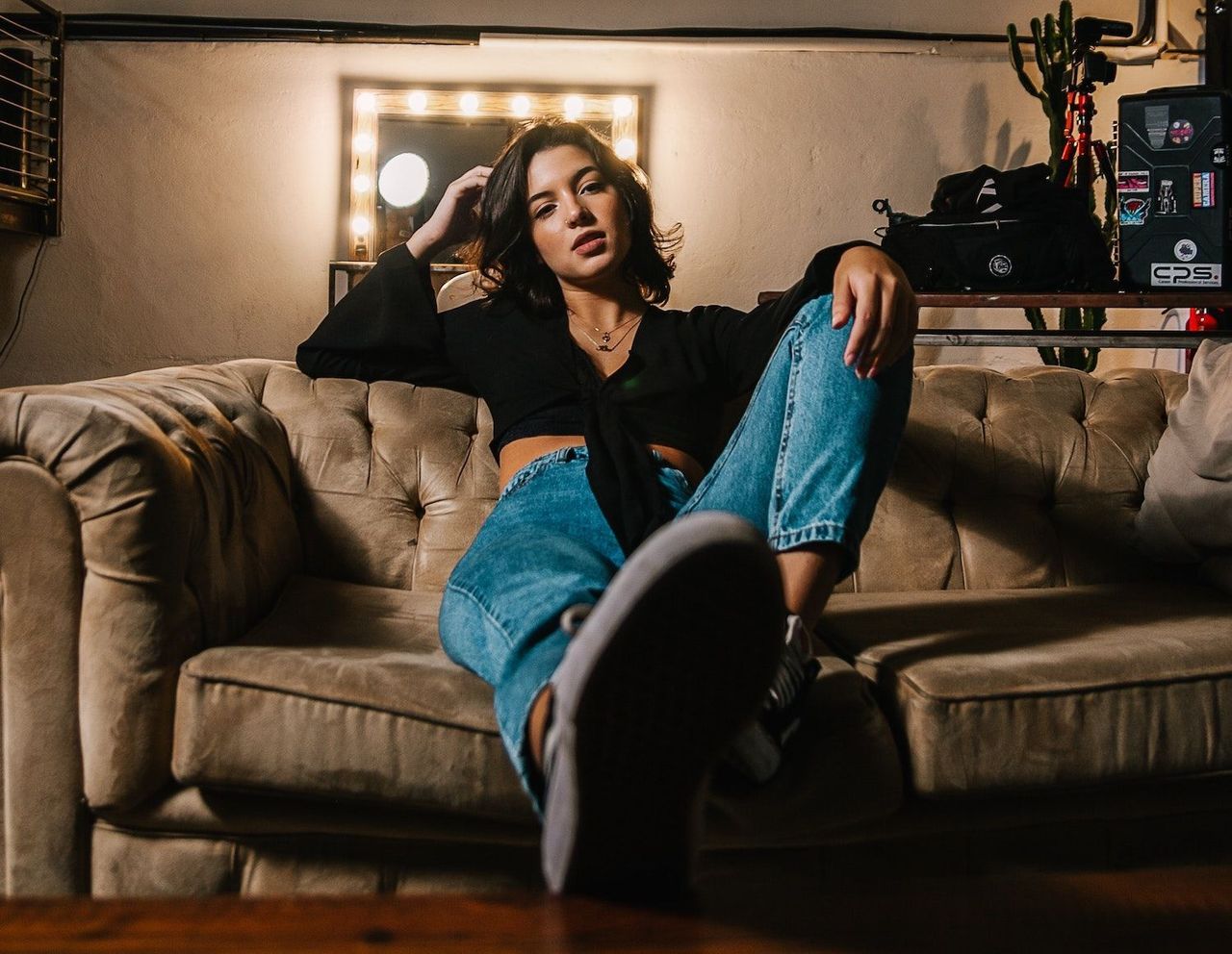Woman chilling on a leather couch