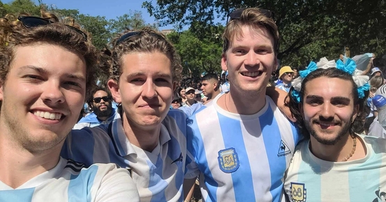 a group of young men are posing for a picture together .