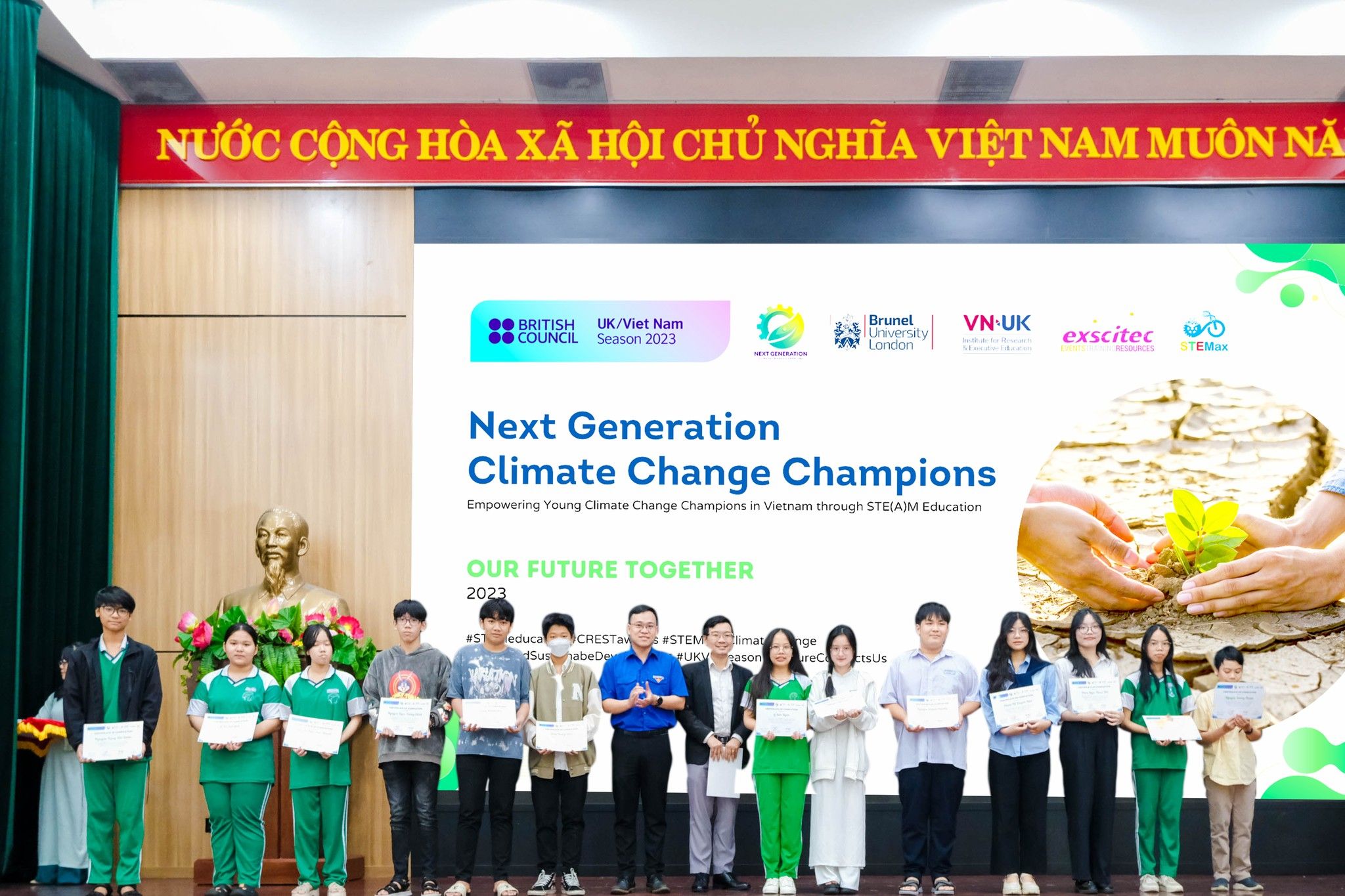 a group of people are standing in a room holding certificates .