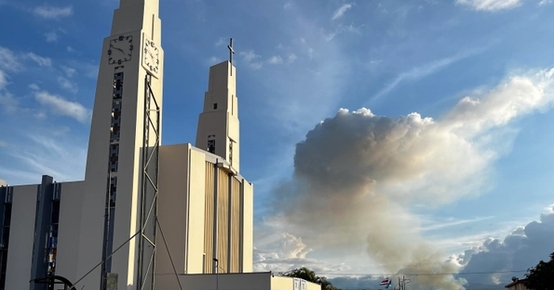 a large white building with a clock on top of it