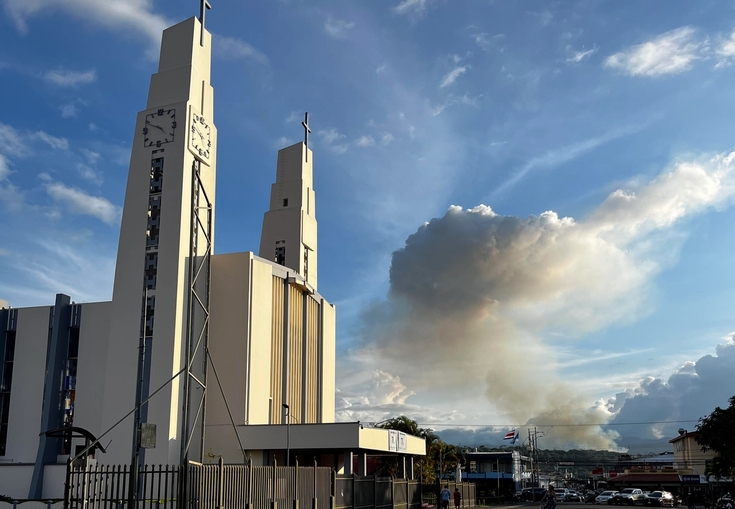 a large white building with a clock on top of it