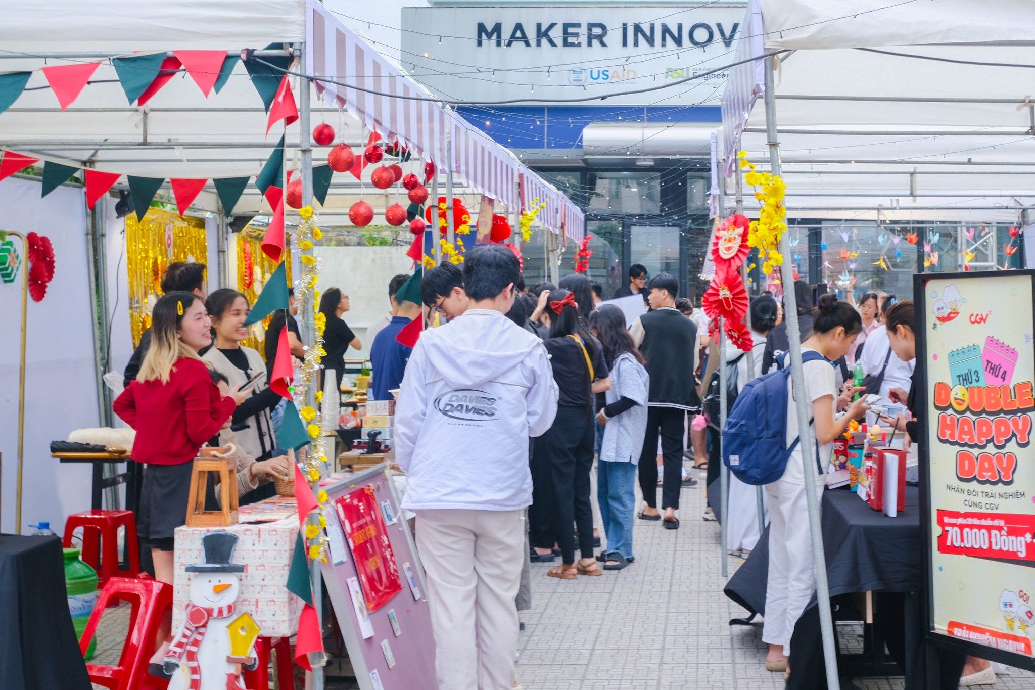 a group of people are standing in a line at a market .
