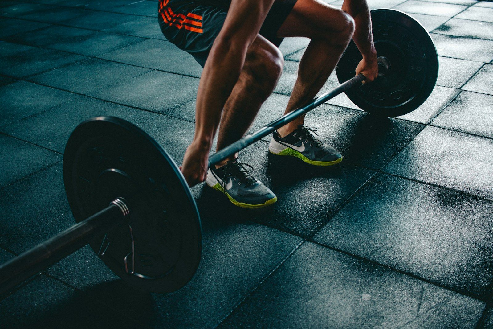 Man lifting barbell representing strength and vitality