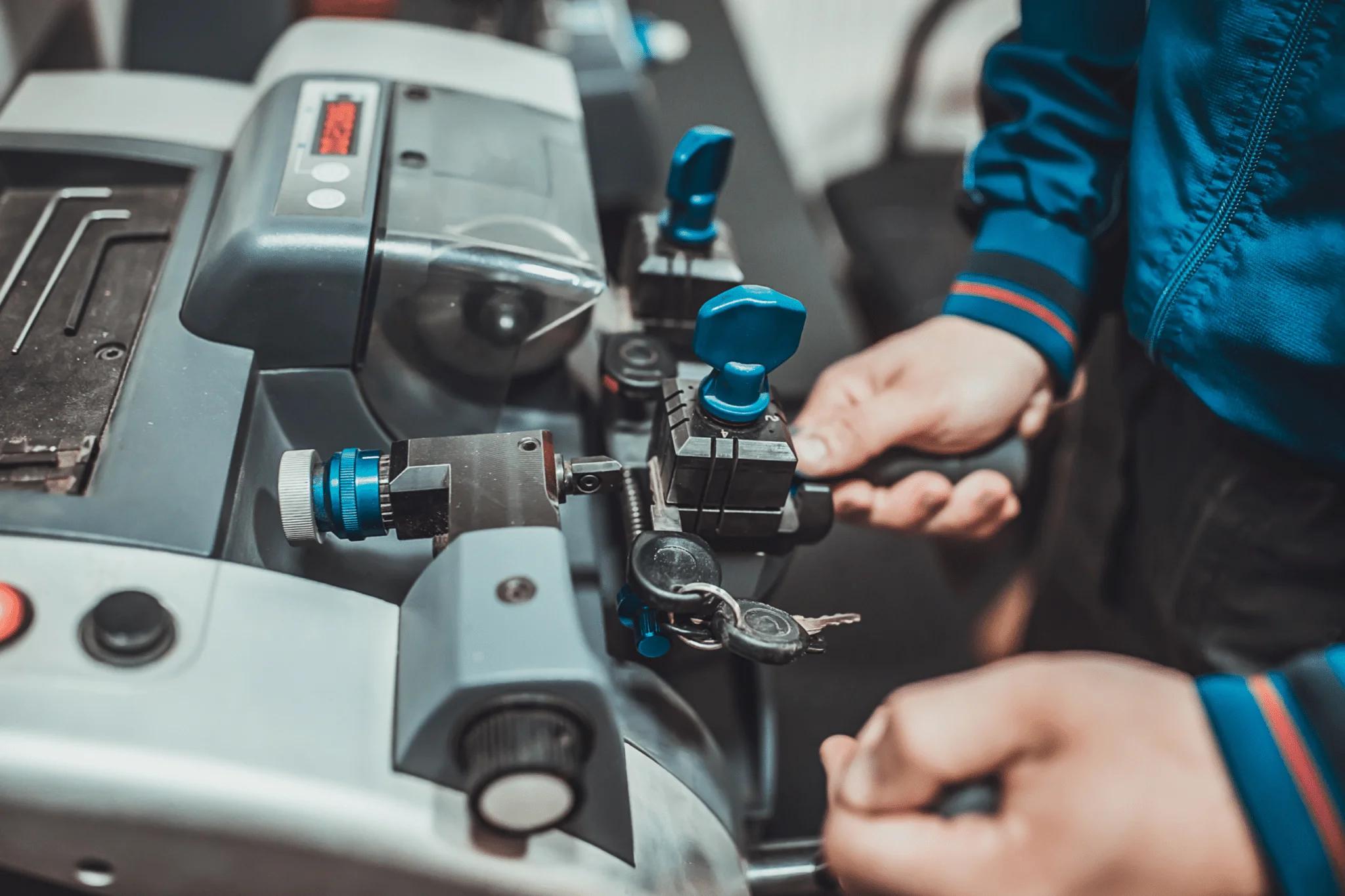 technician cutting replacement key