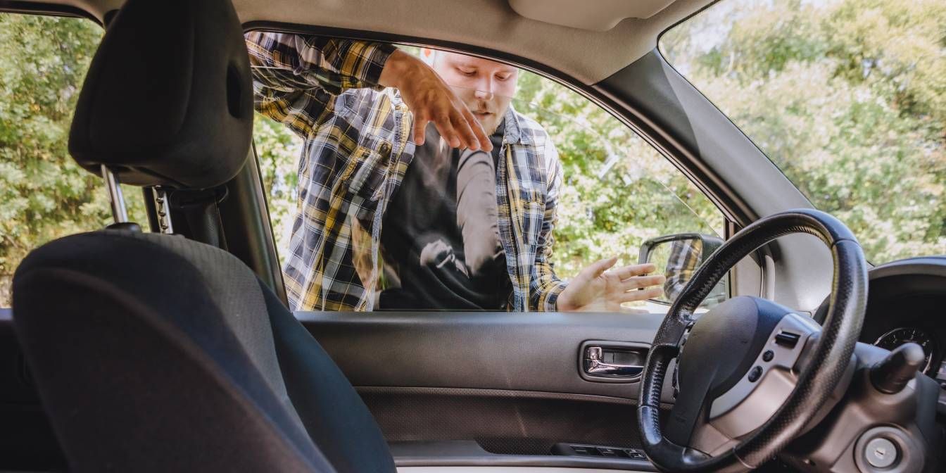 man with keys locked inside car