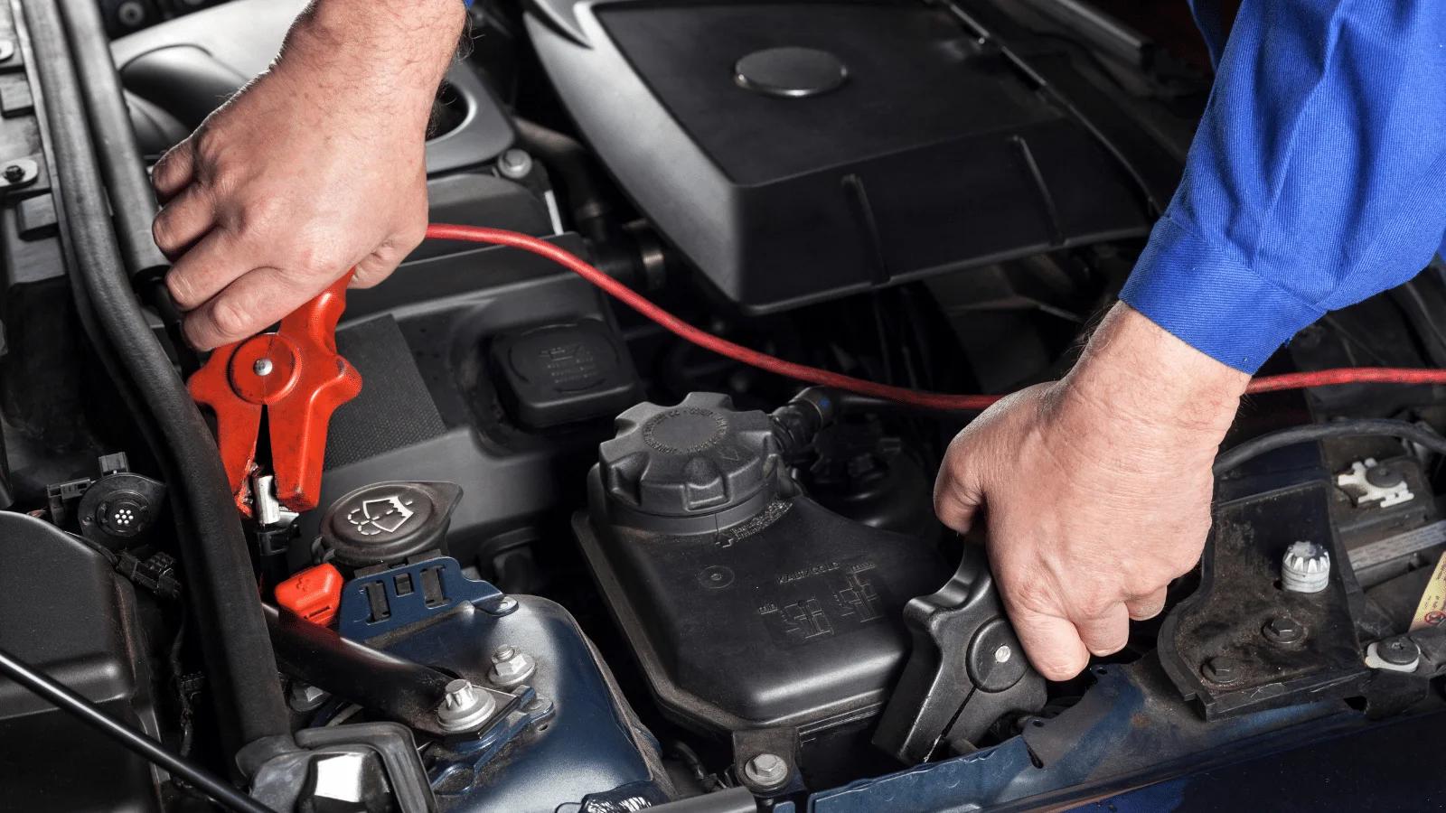 mechanic jump start car battery jumper cables