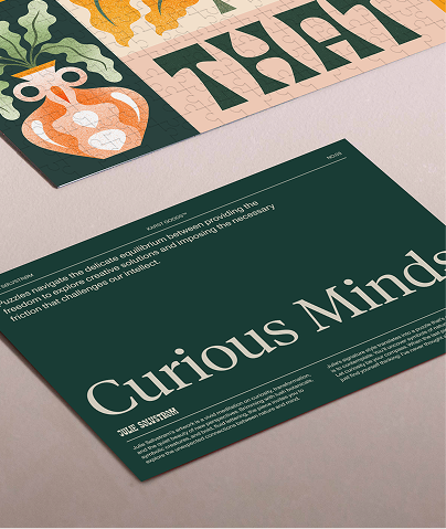 A double-sided card offers insight into the artist’s work and a full reference image to guide your puzzle experience.