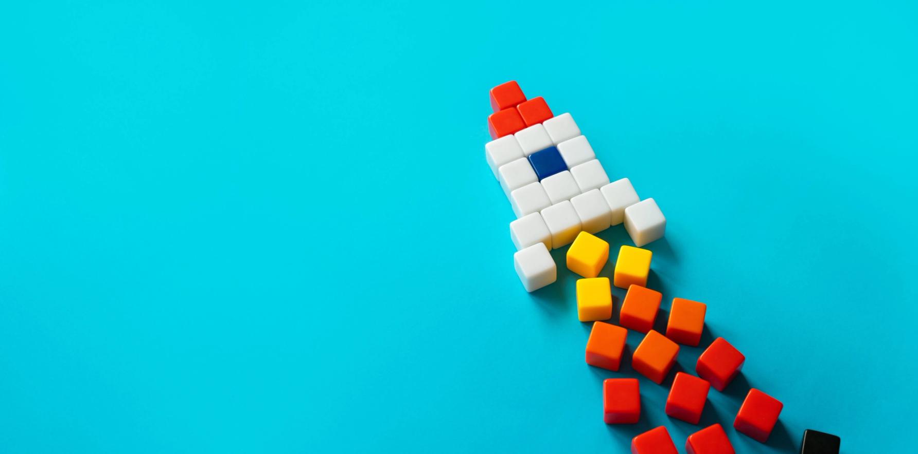 colored blocks in the shape of a rocket taking off