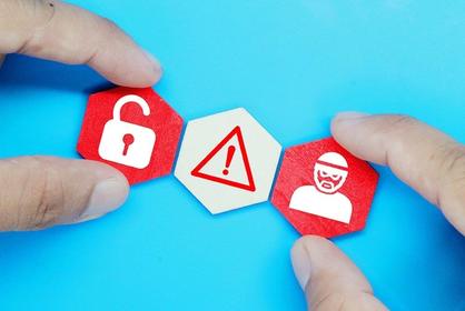 person holding icons representing cyber security threats