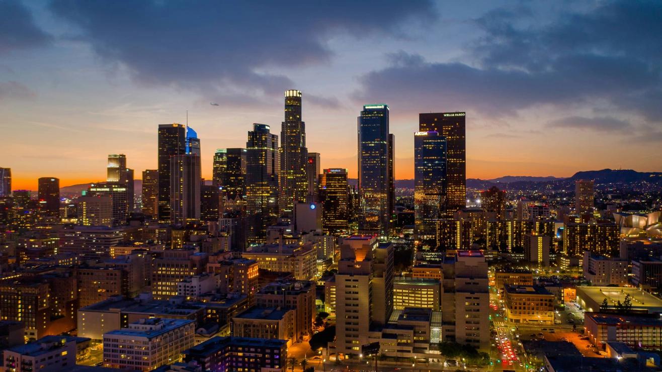 The downtown Los Angeles skyline at night.