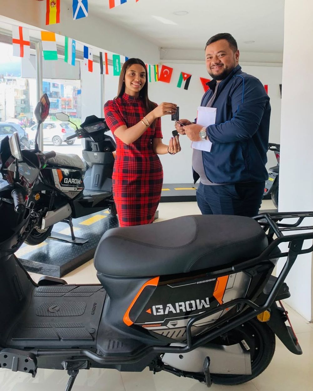 A rider with their newly delivered scooter