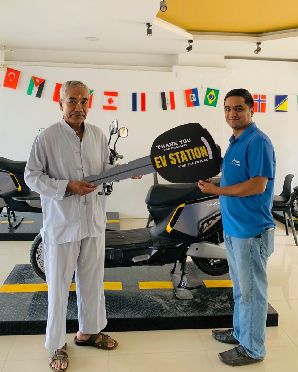 A customer collecting their new electric scooter