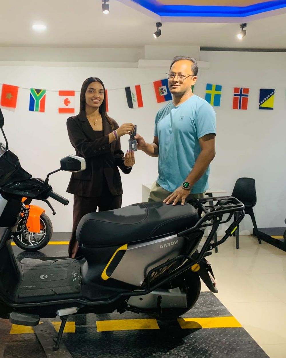 Handing over the keys to a new Garow scooter