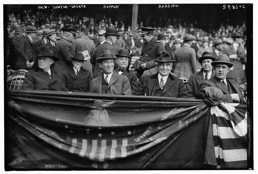 Albert Lasker and Warren Harding sit in the stands at a New York Yankees game