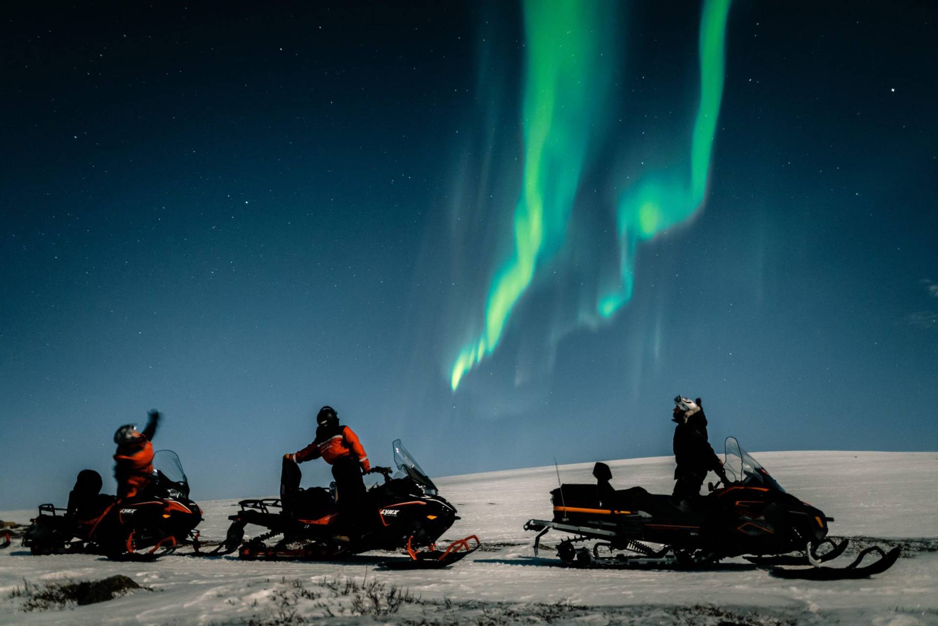 Northern Lights by Snowmobile